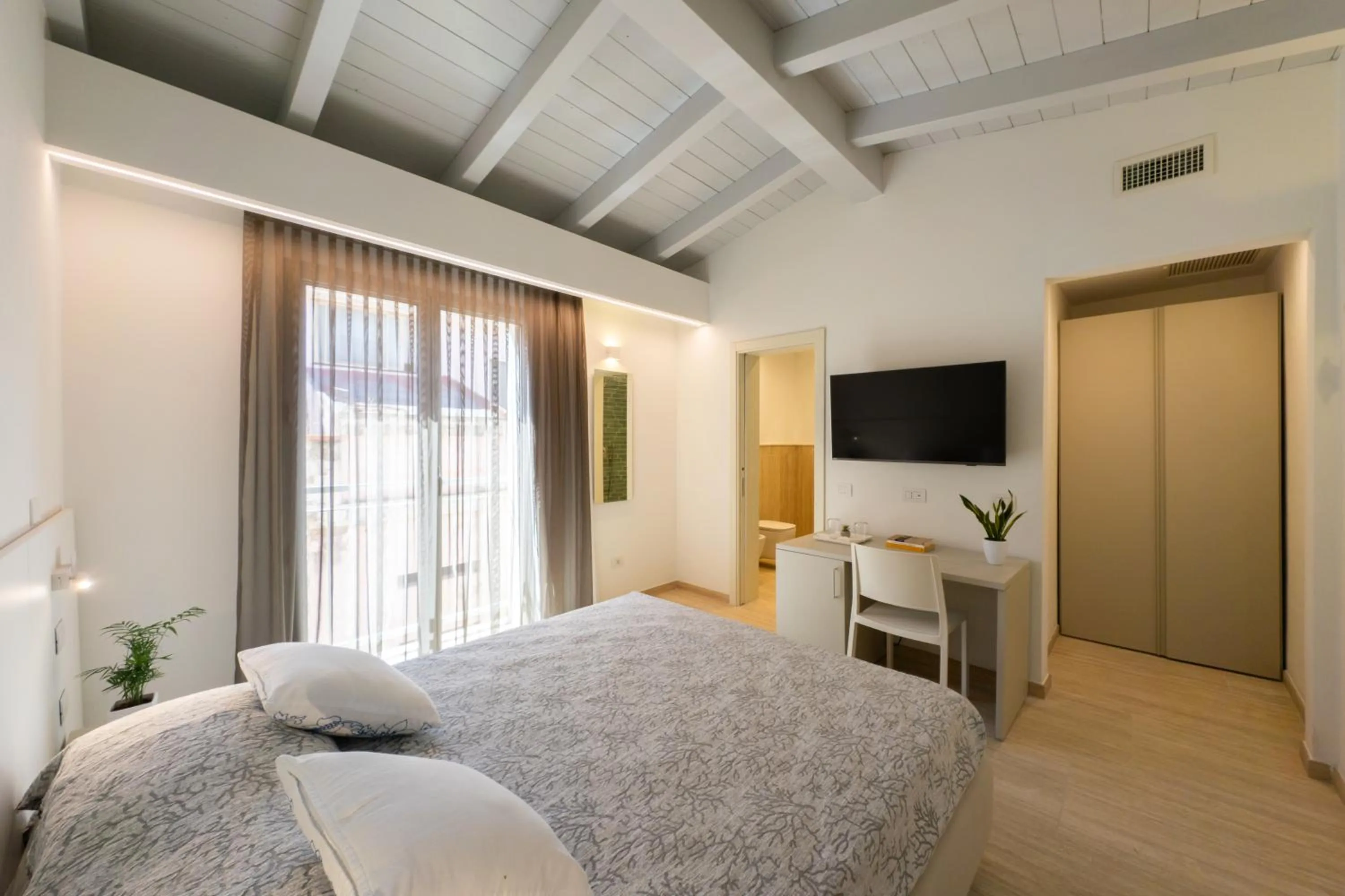 Bed in Domu Noa Hotel