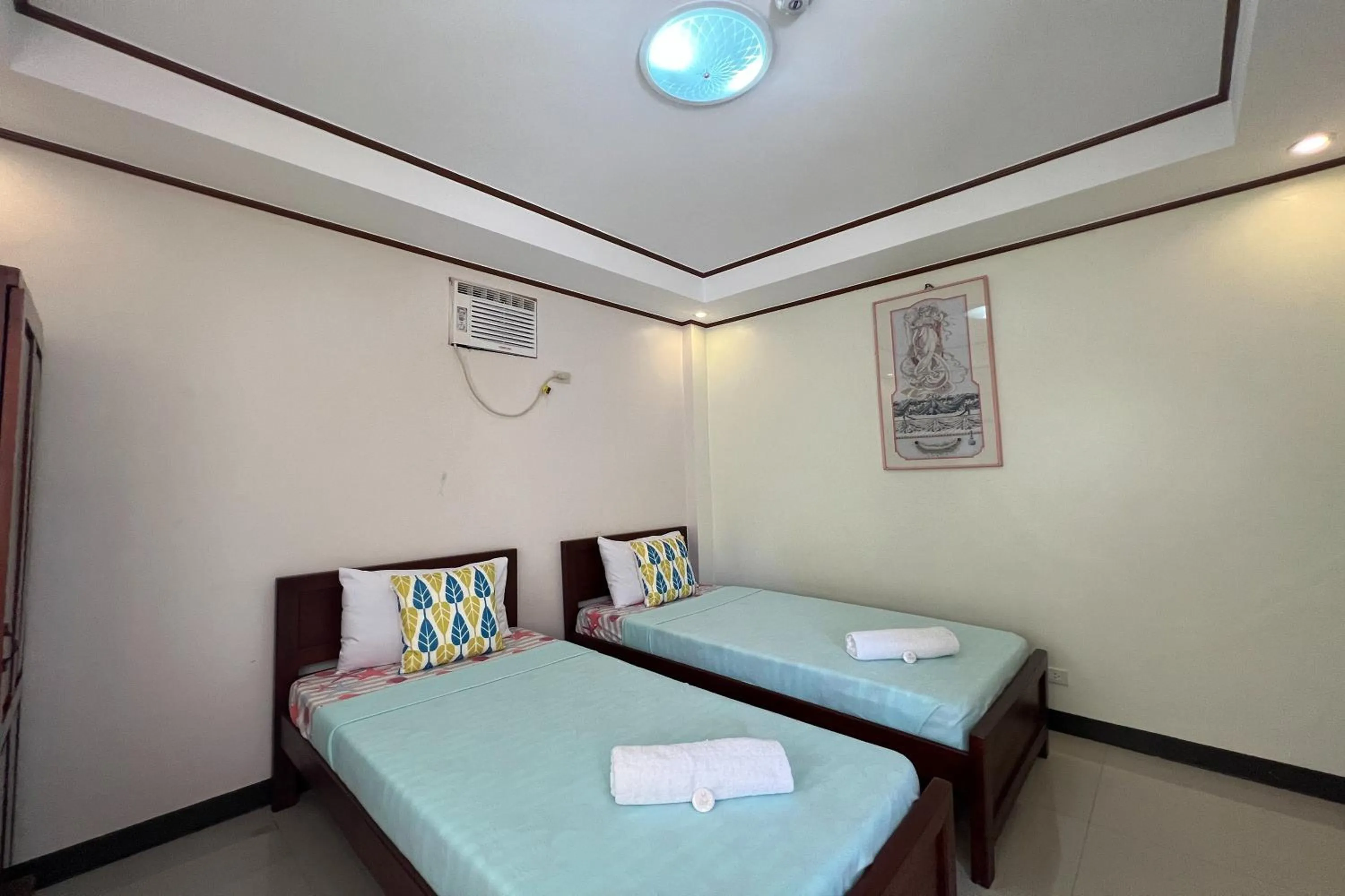 Bed in Dinah's Tourist Inn Puerto Princesa