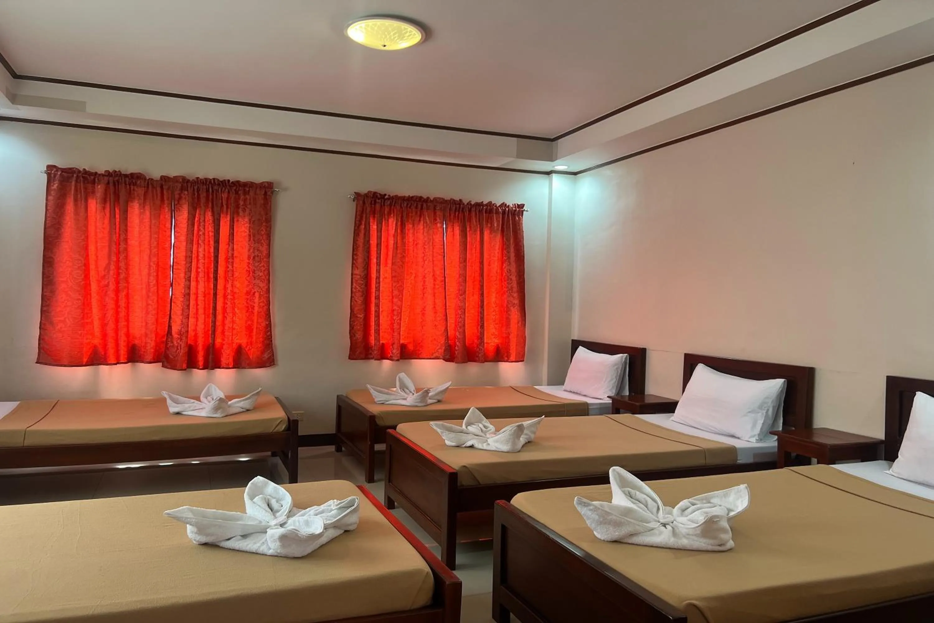 Bedroom, Bed in Dinah's Tourist Inn Puerto Princesa