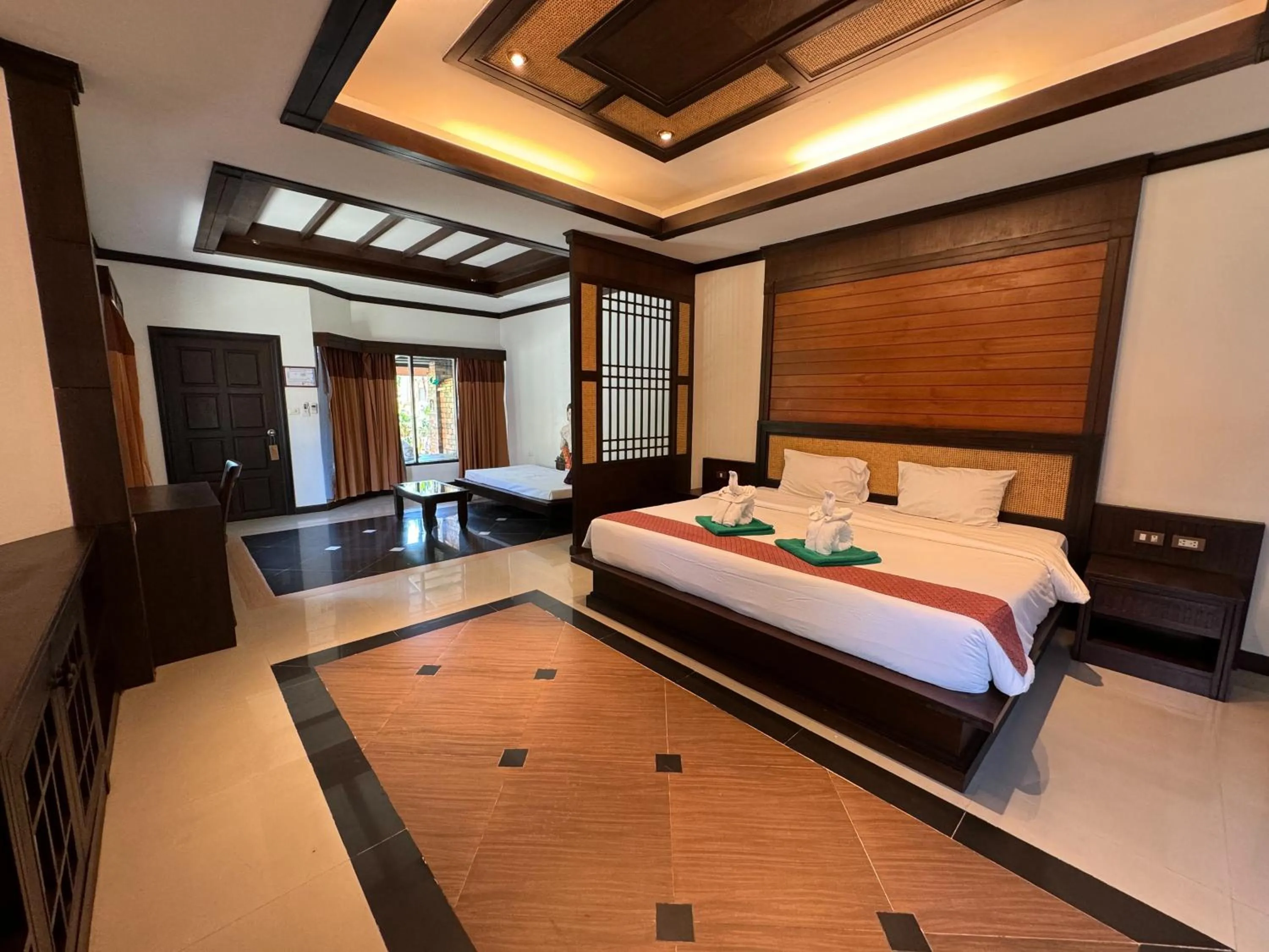 Bed in Hotel and Beach Bungalow at Lanta Resort