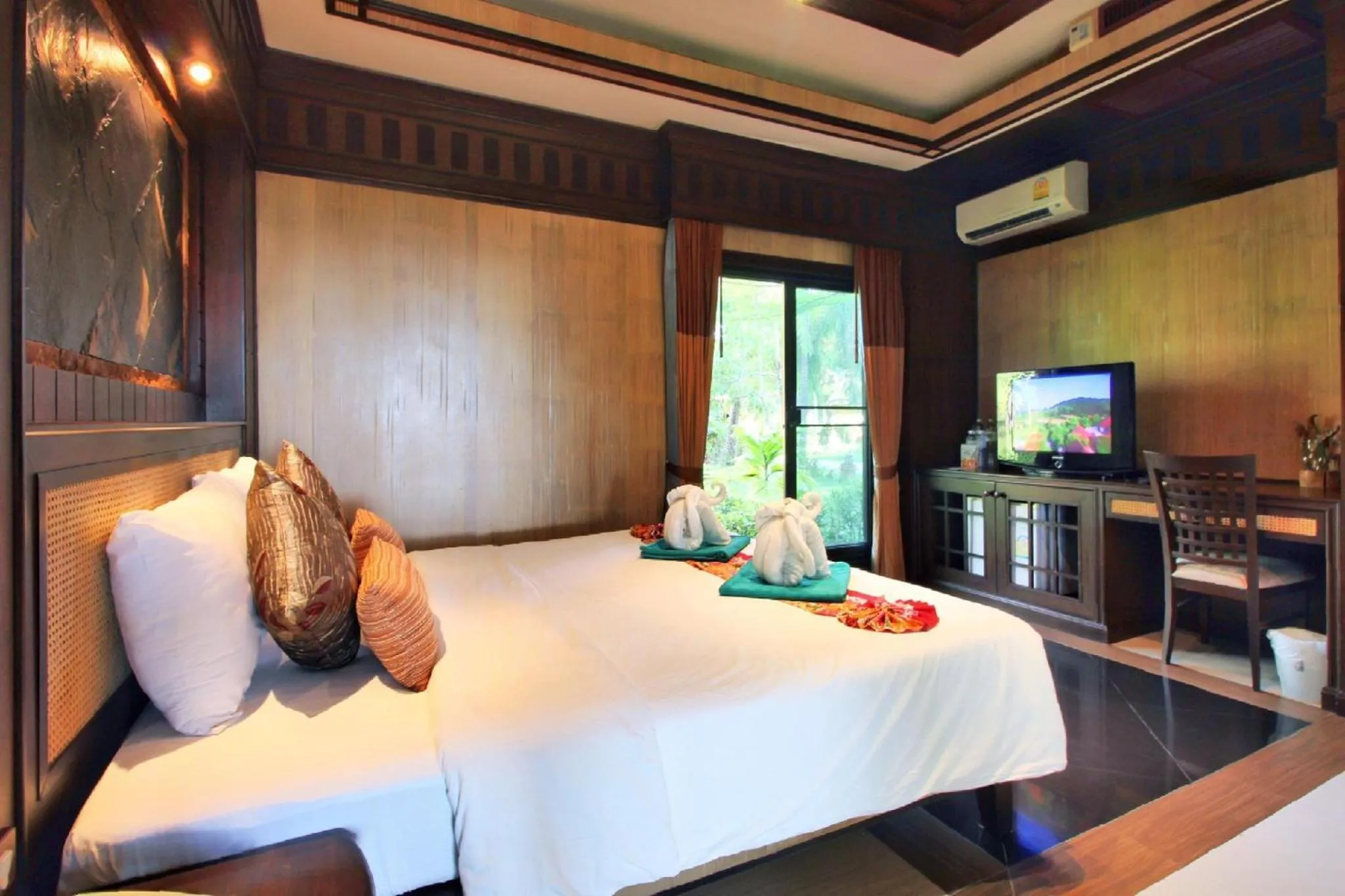 Bedroom, Bed in Hotel and Beach Bungalow at Lanta Resort