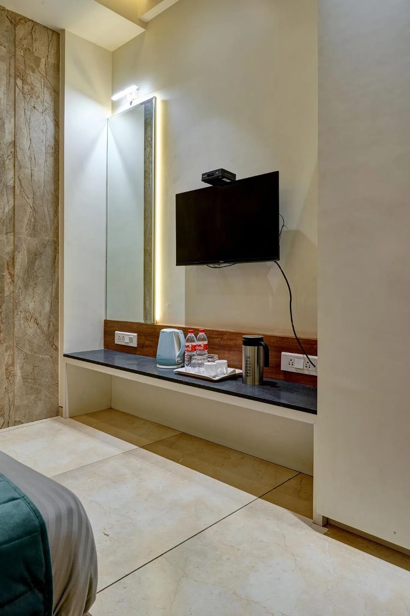 Communal lounge/ TV room, Bed in Hotel Swamini Kolhapur