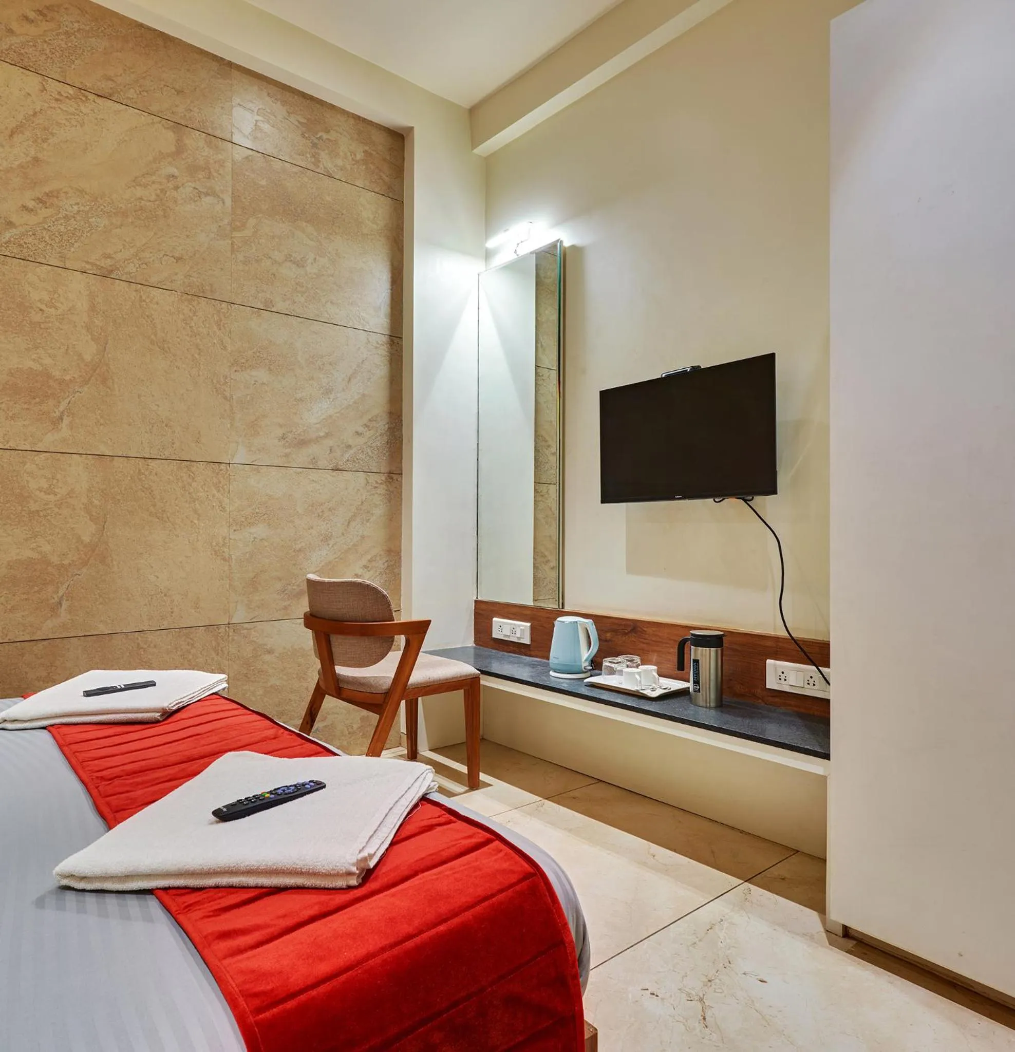 Bed in Hotel Swamini Kolhapur