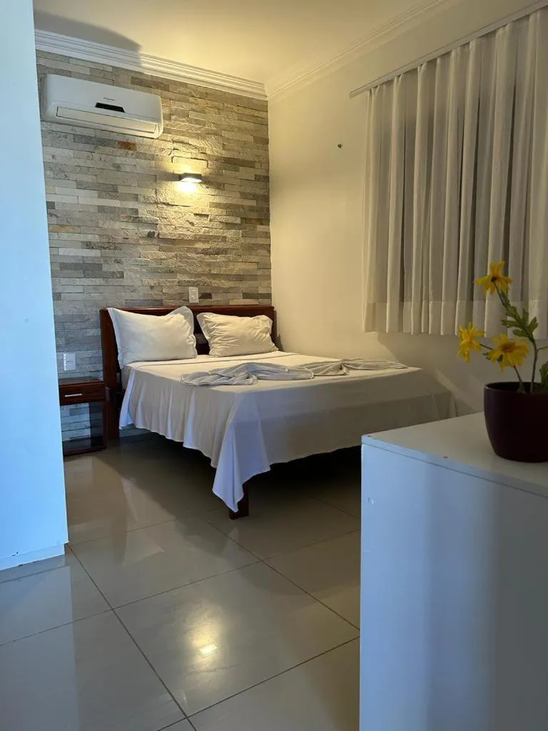 Bed in Pousada Refúgio Jardim de Canoa by Borboleta