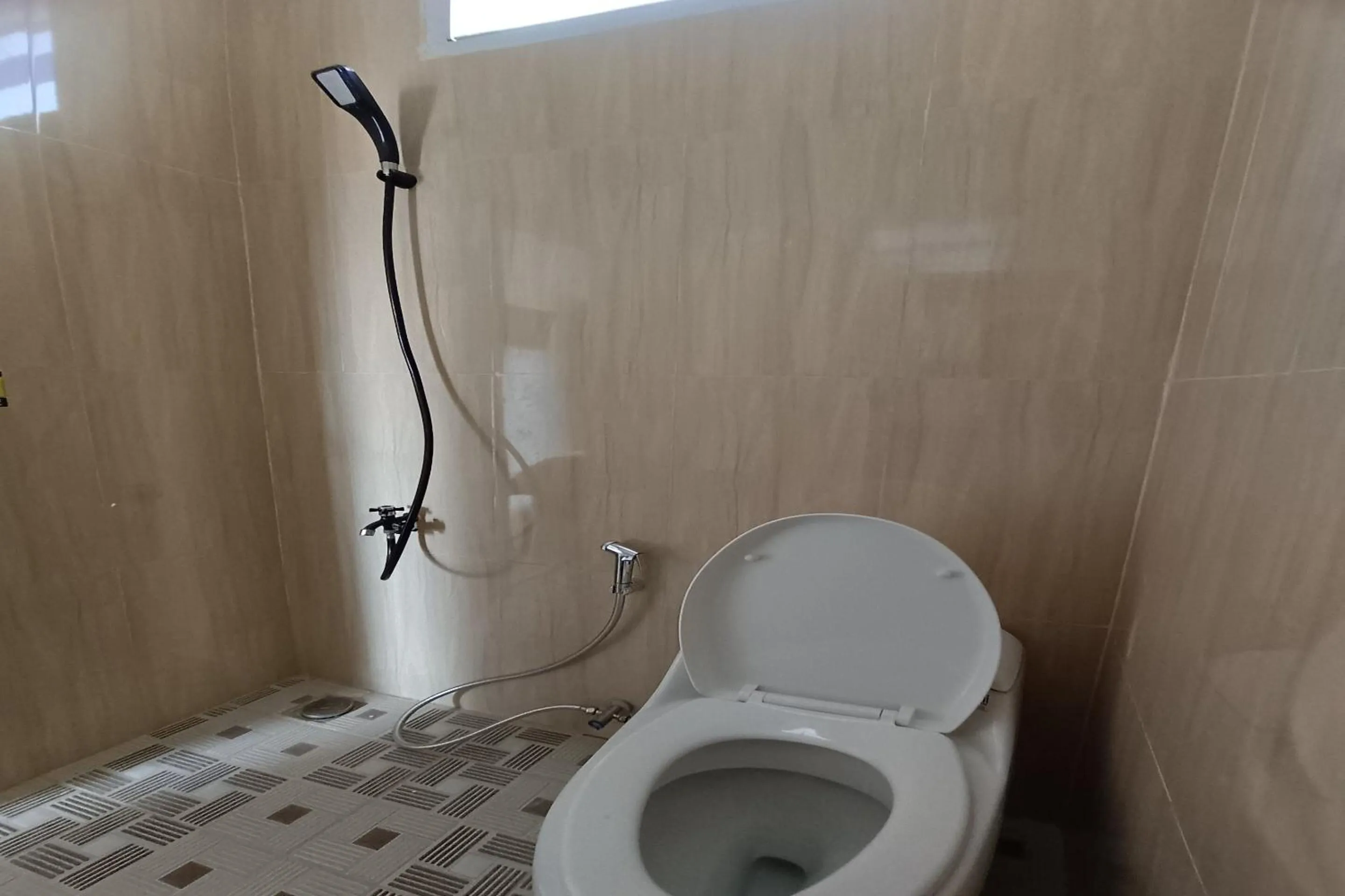 Bathroom in Hotel O Merah House