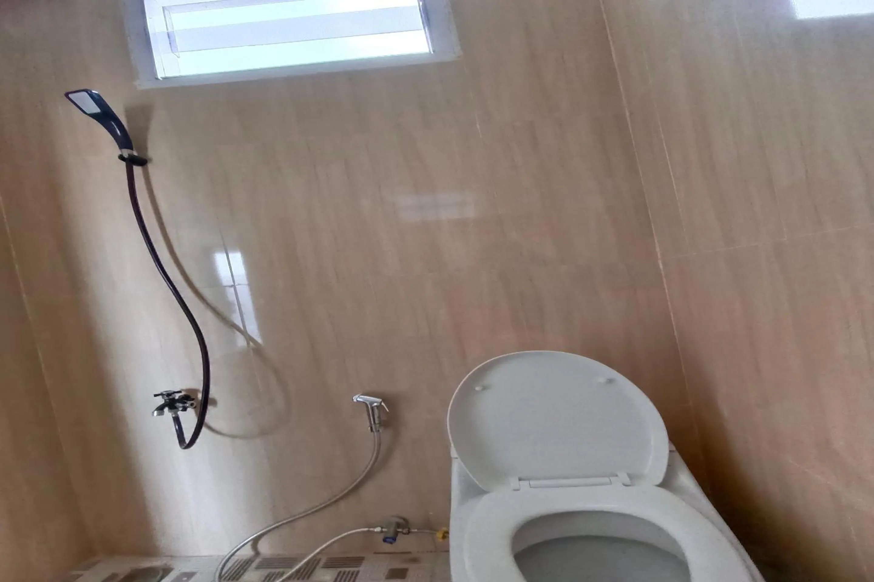 Bathroom in Hotel O Merah House