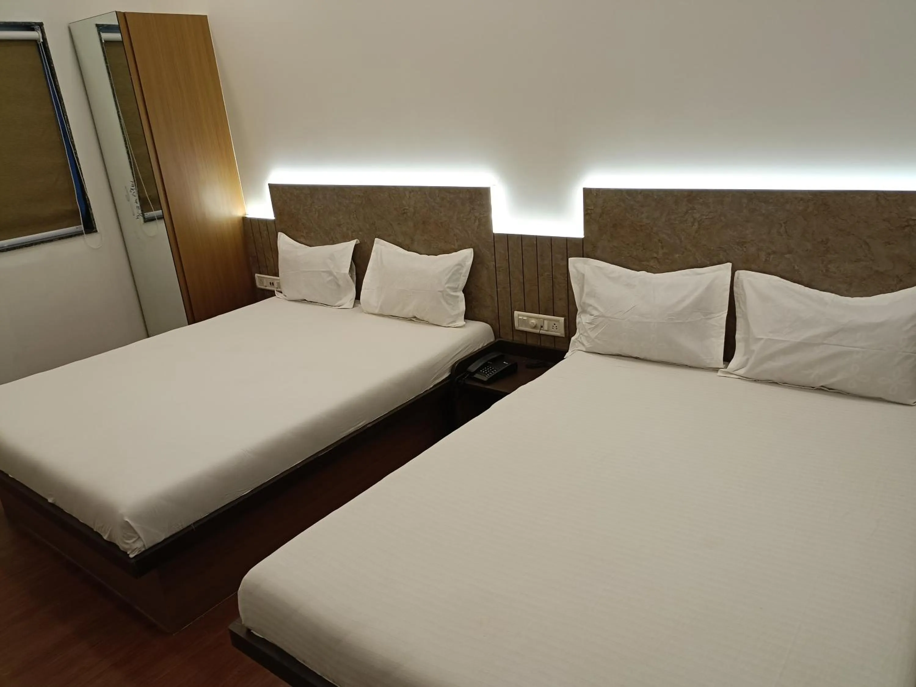 Bed in Hotel Ritz Vesu - Hotels in Vesu, Surat