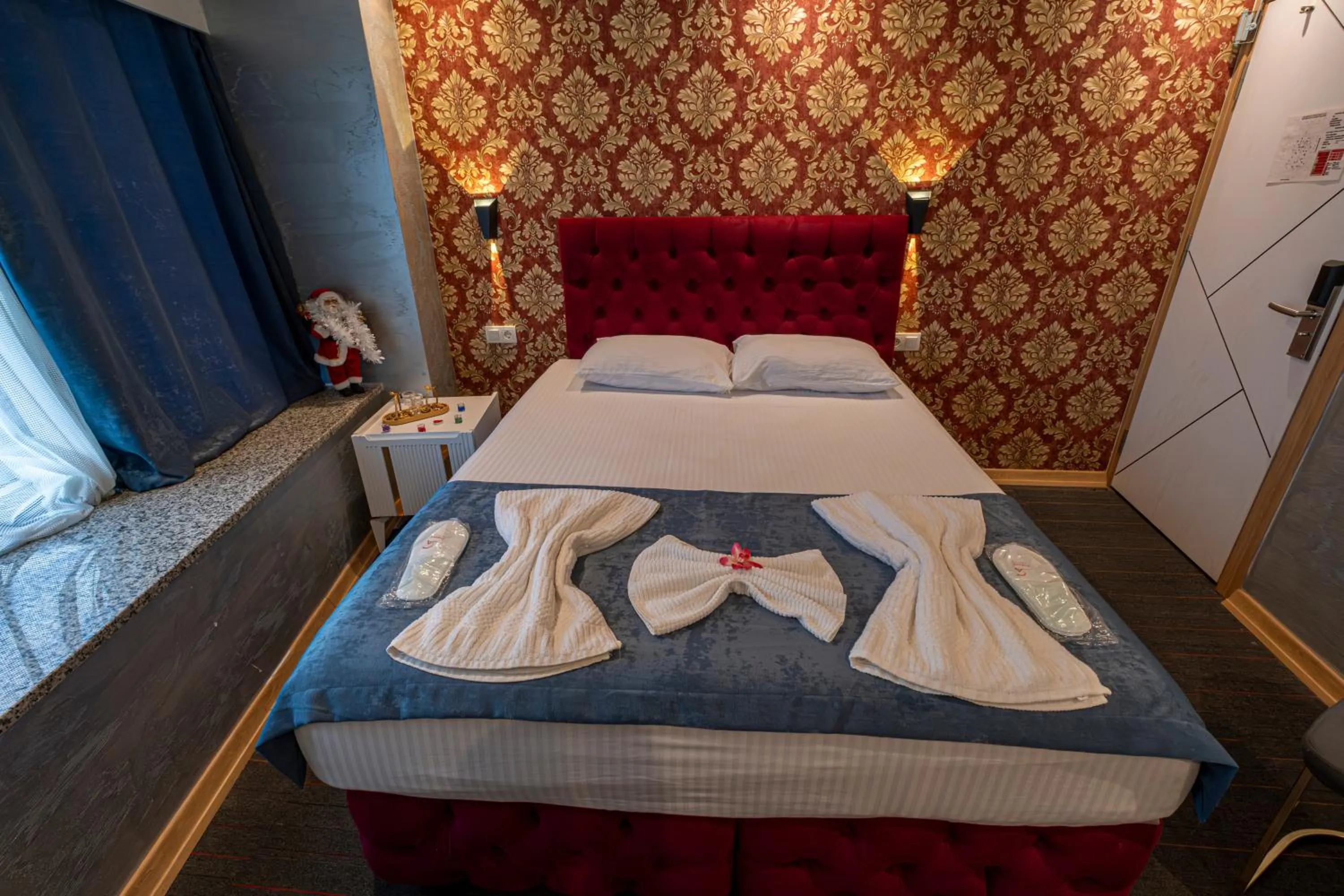 Bed in Stay Suite Hotel