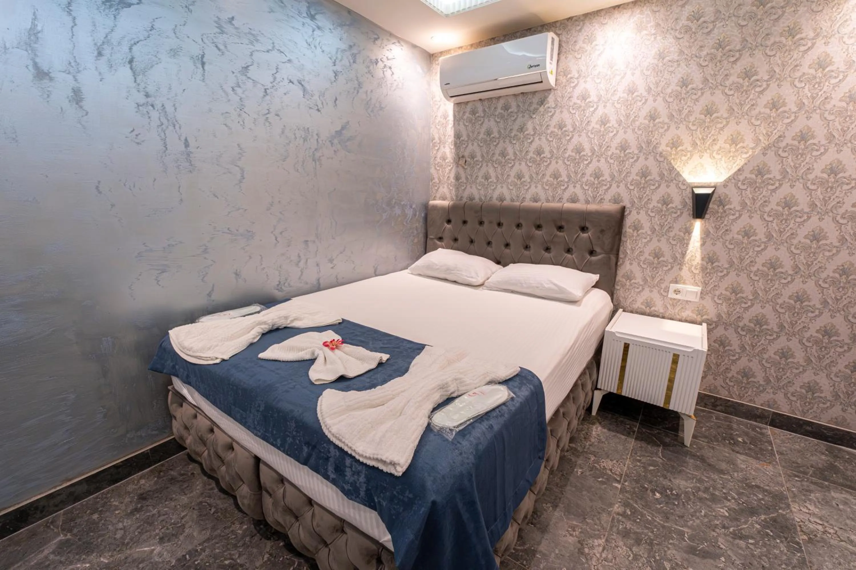 Bed in Stay Suite Hotel