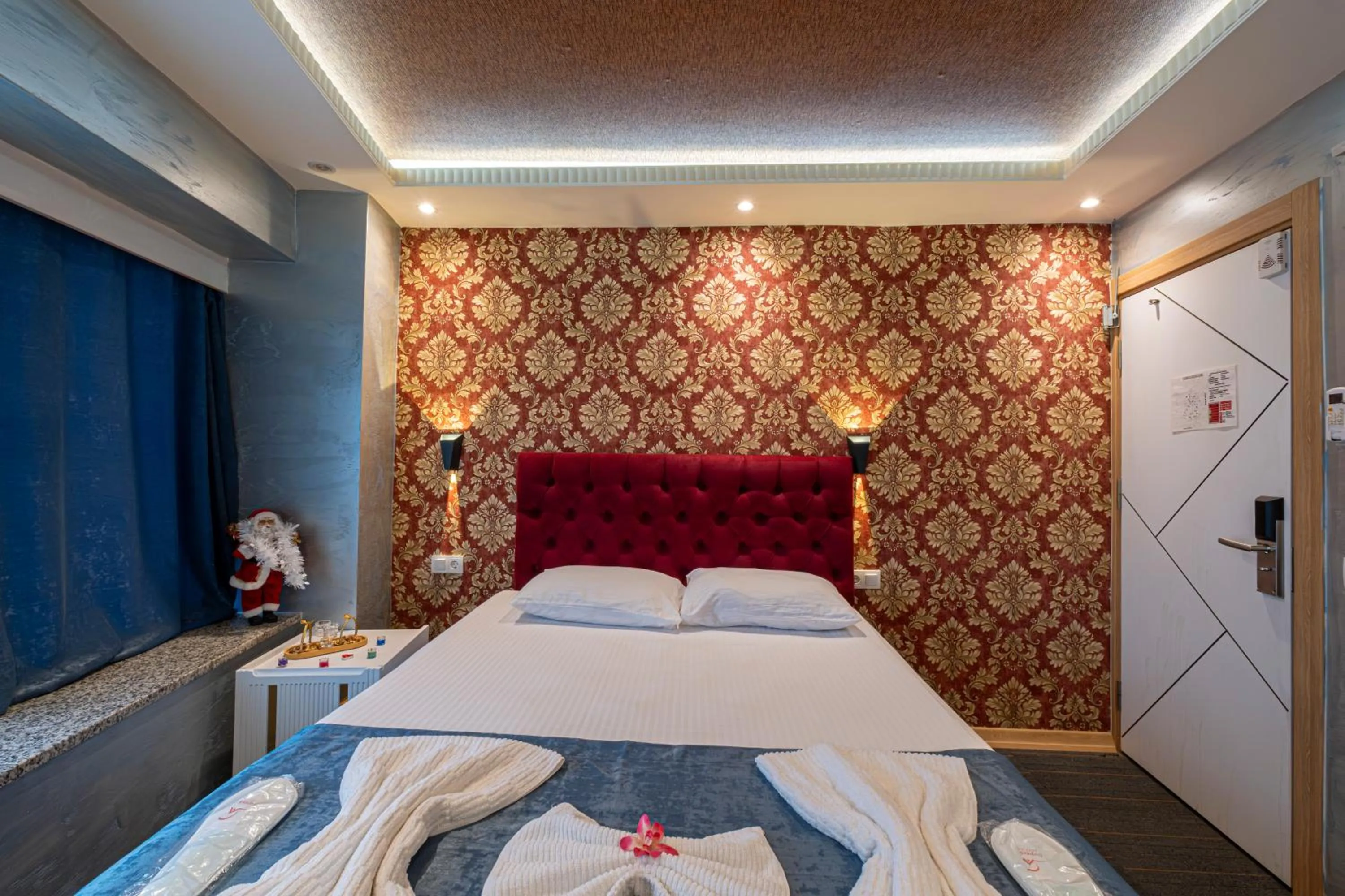 Bed in Stay Suite Hotel