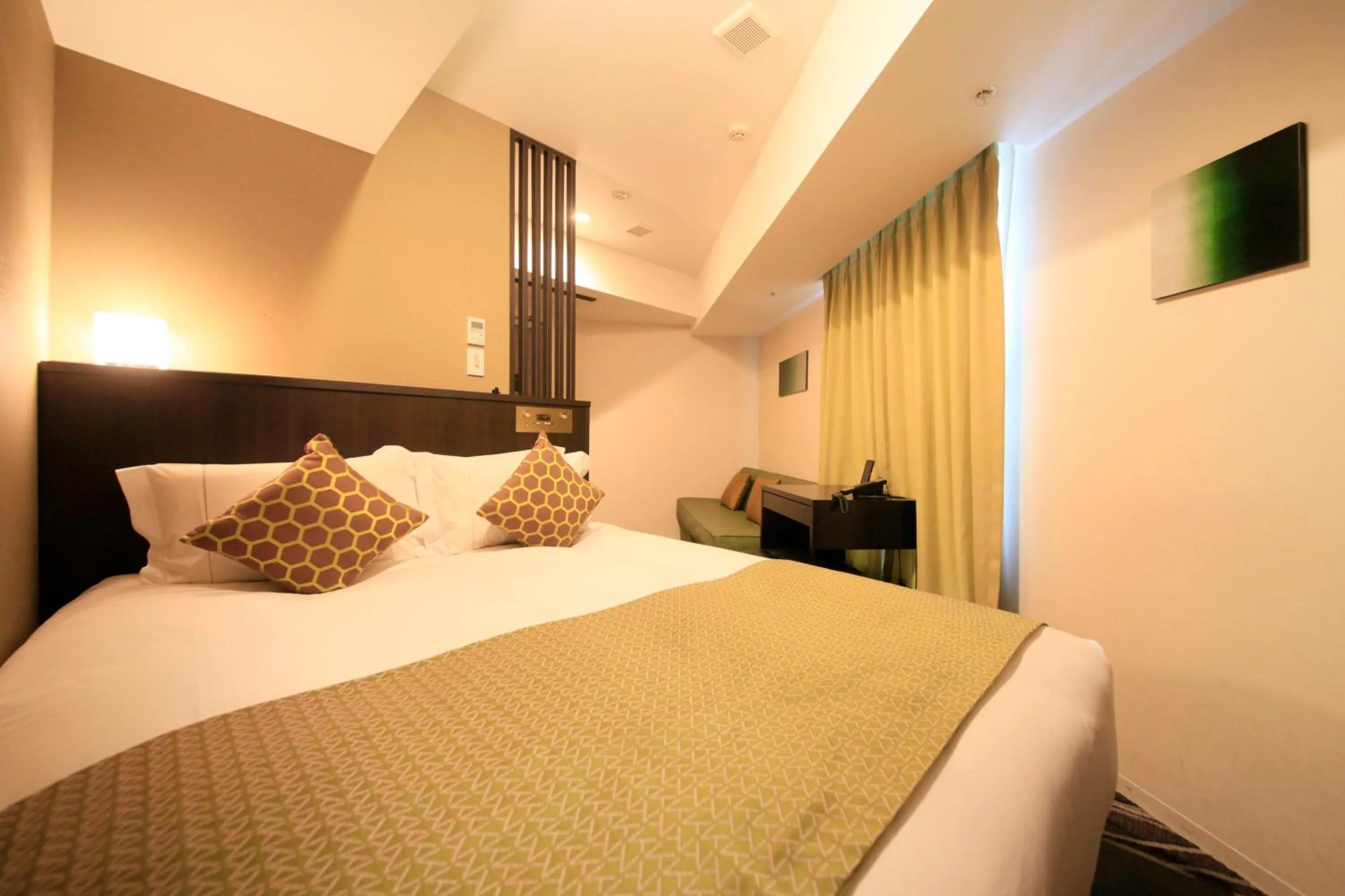 Photo of the whole room, Bed in Centurion Hotel Ikebukuro Station