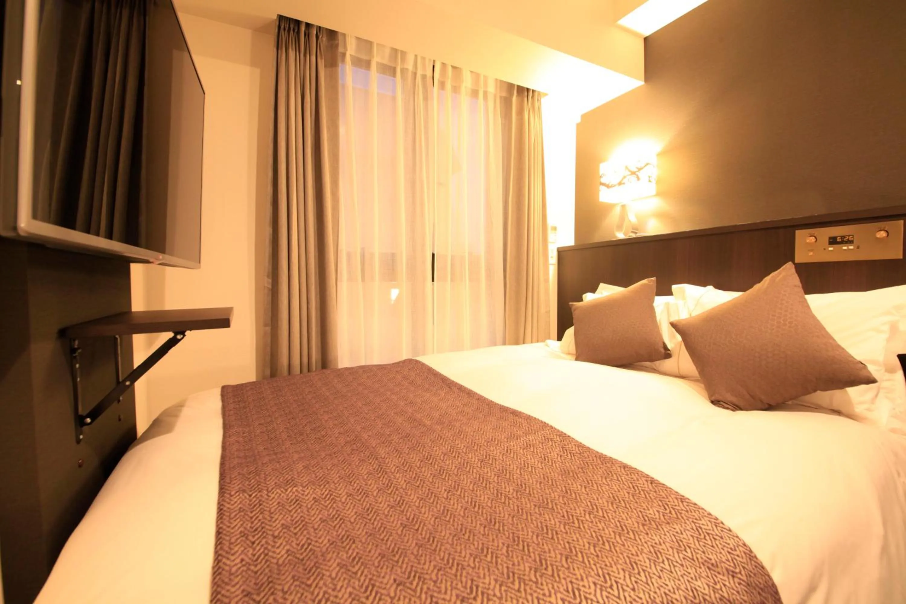 Photo of the whole room, Bed in Centurion Hotel Ikebukuro Station