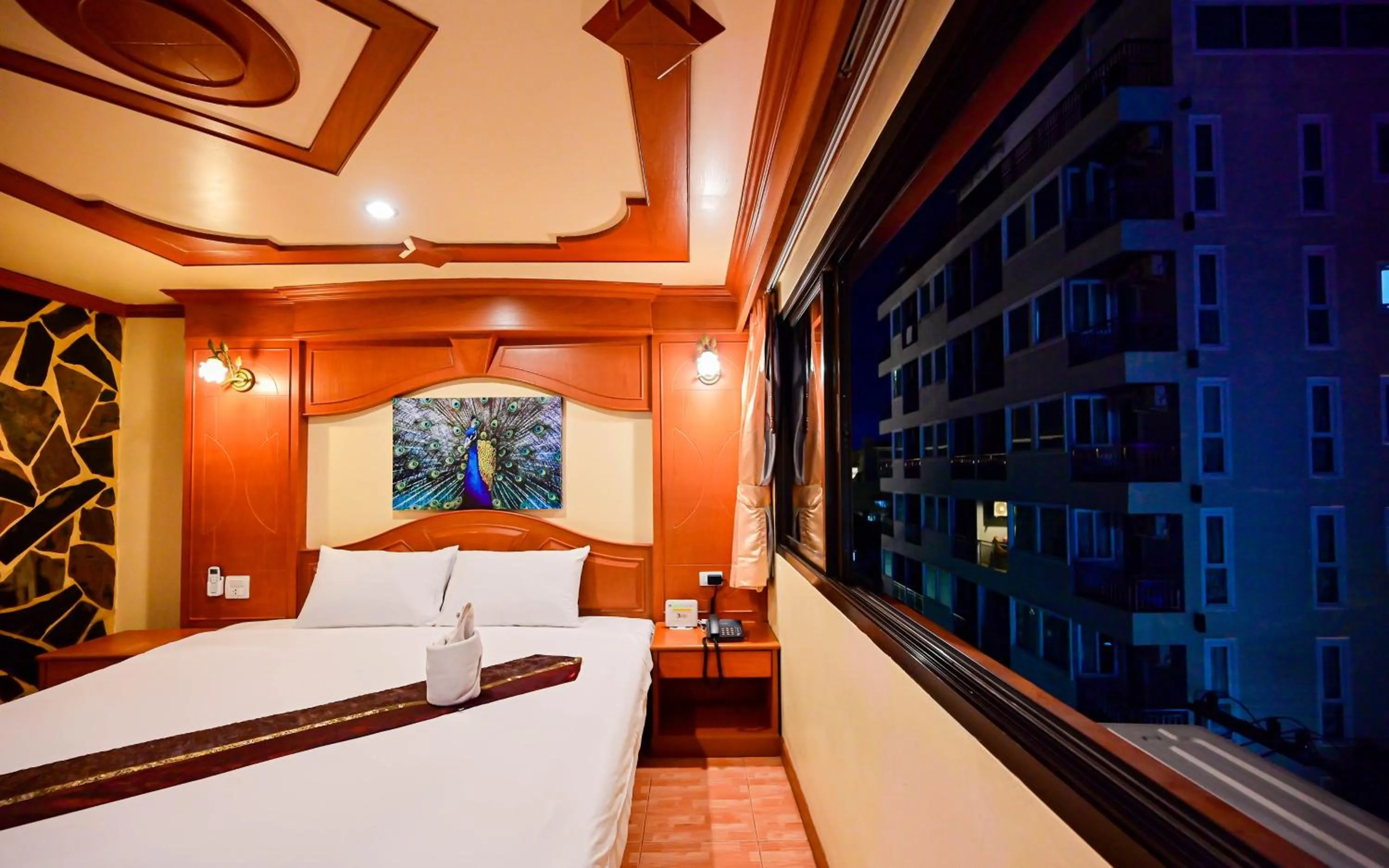 Bed in Tiger Complex Hotel