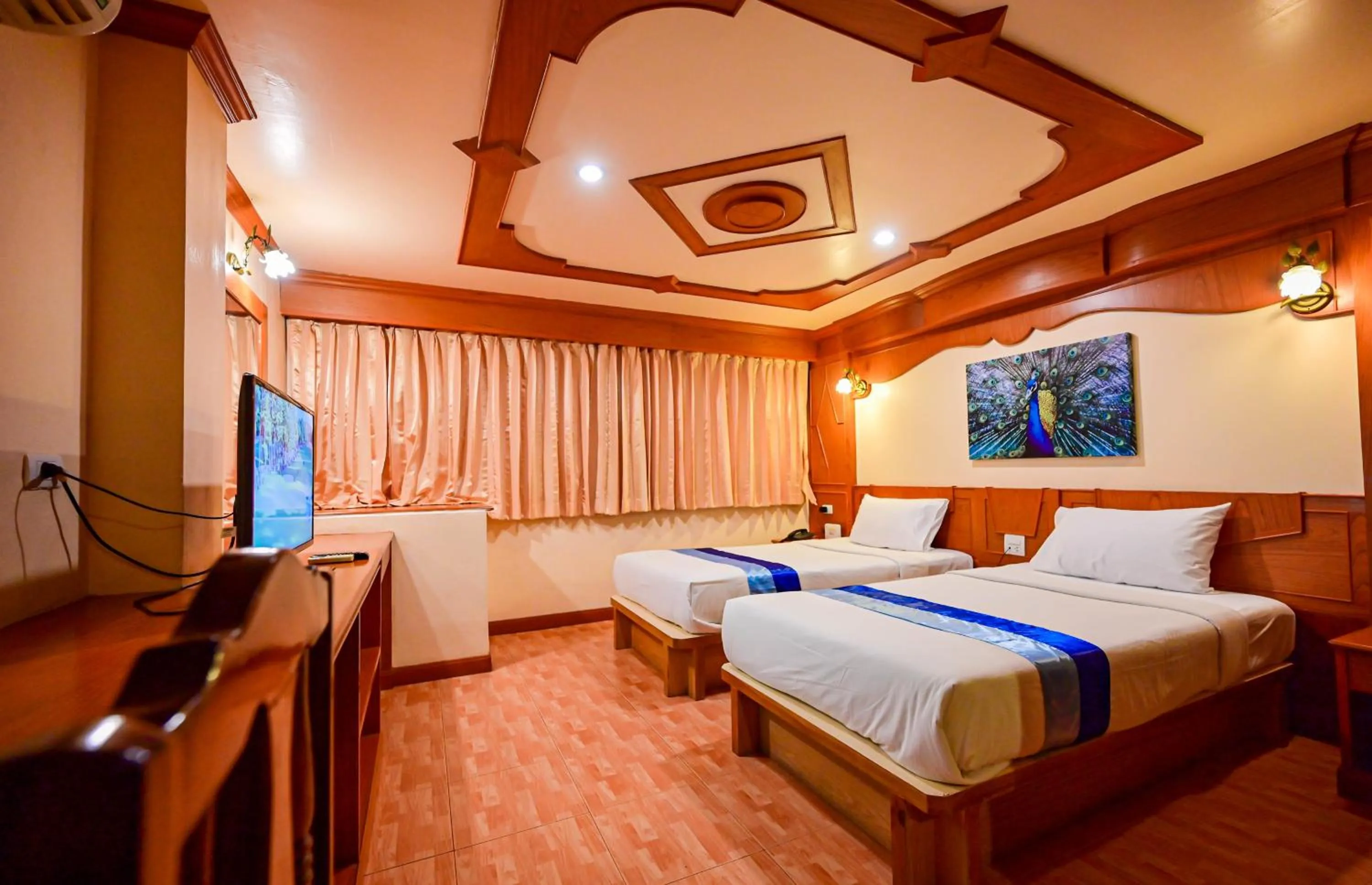 Bed in Tiger Complex Hotel