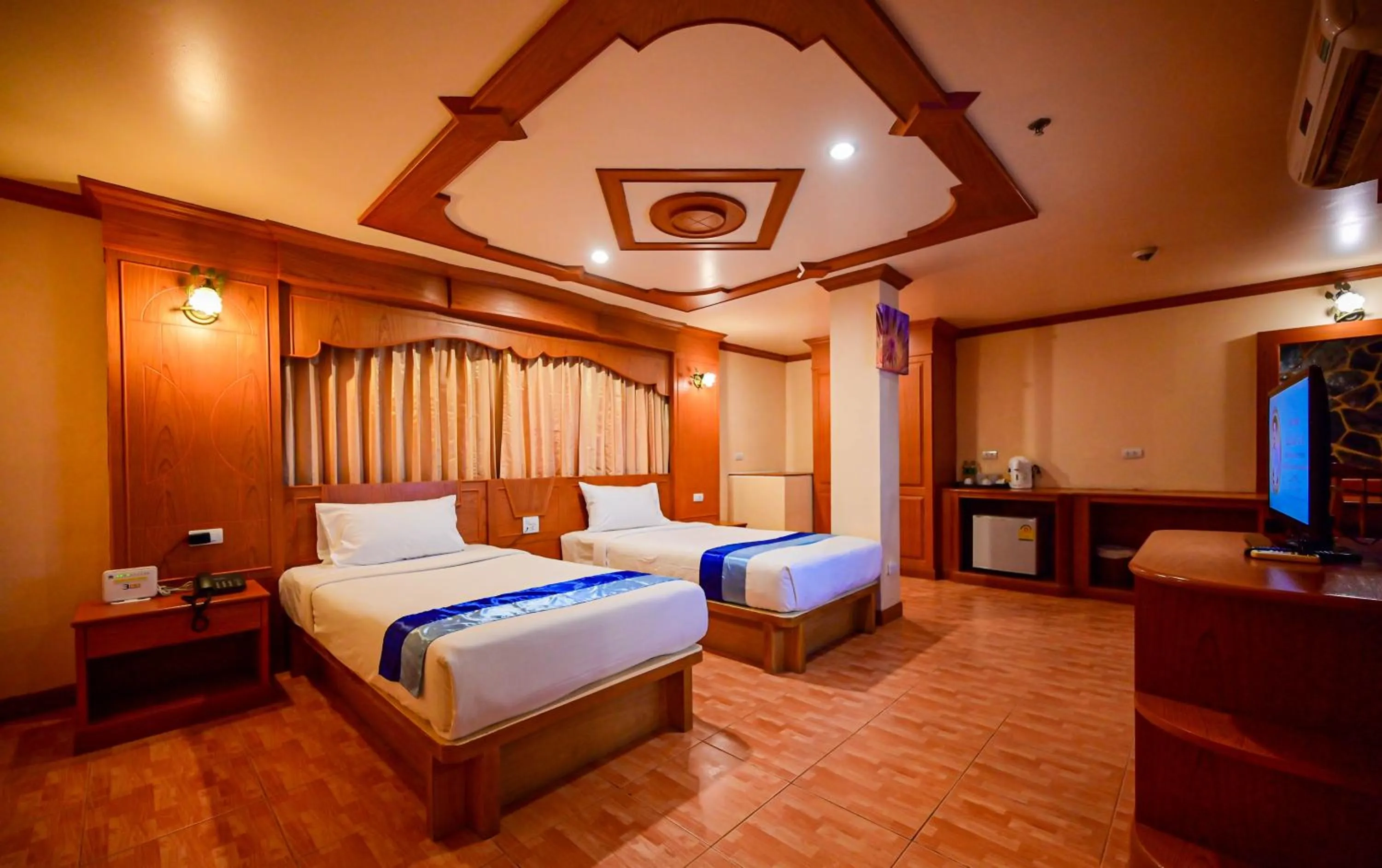 Bed in Tiger Complex Hotel