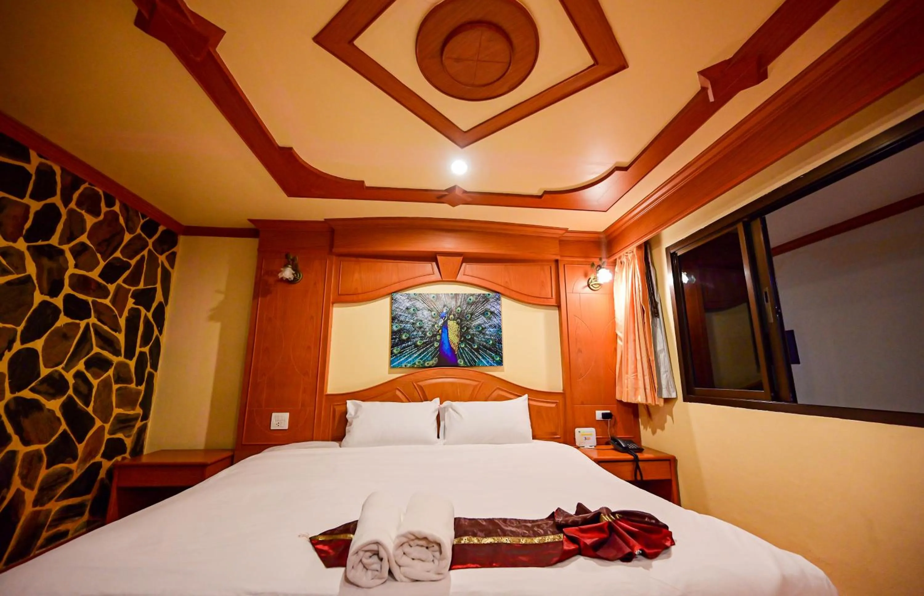 Bed in Tiger Complex Hotel