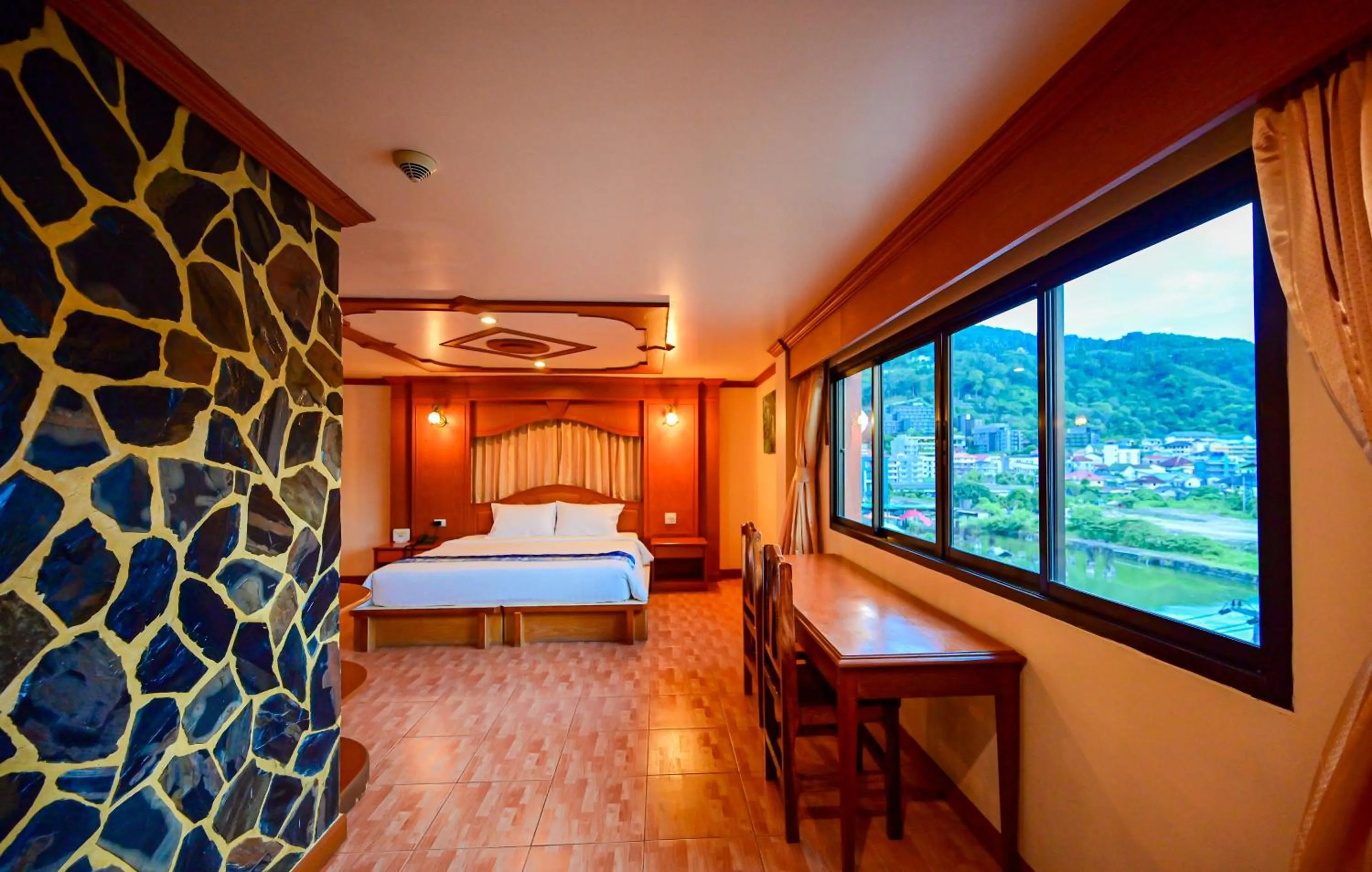 Bed in Tiger Complex Hotel