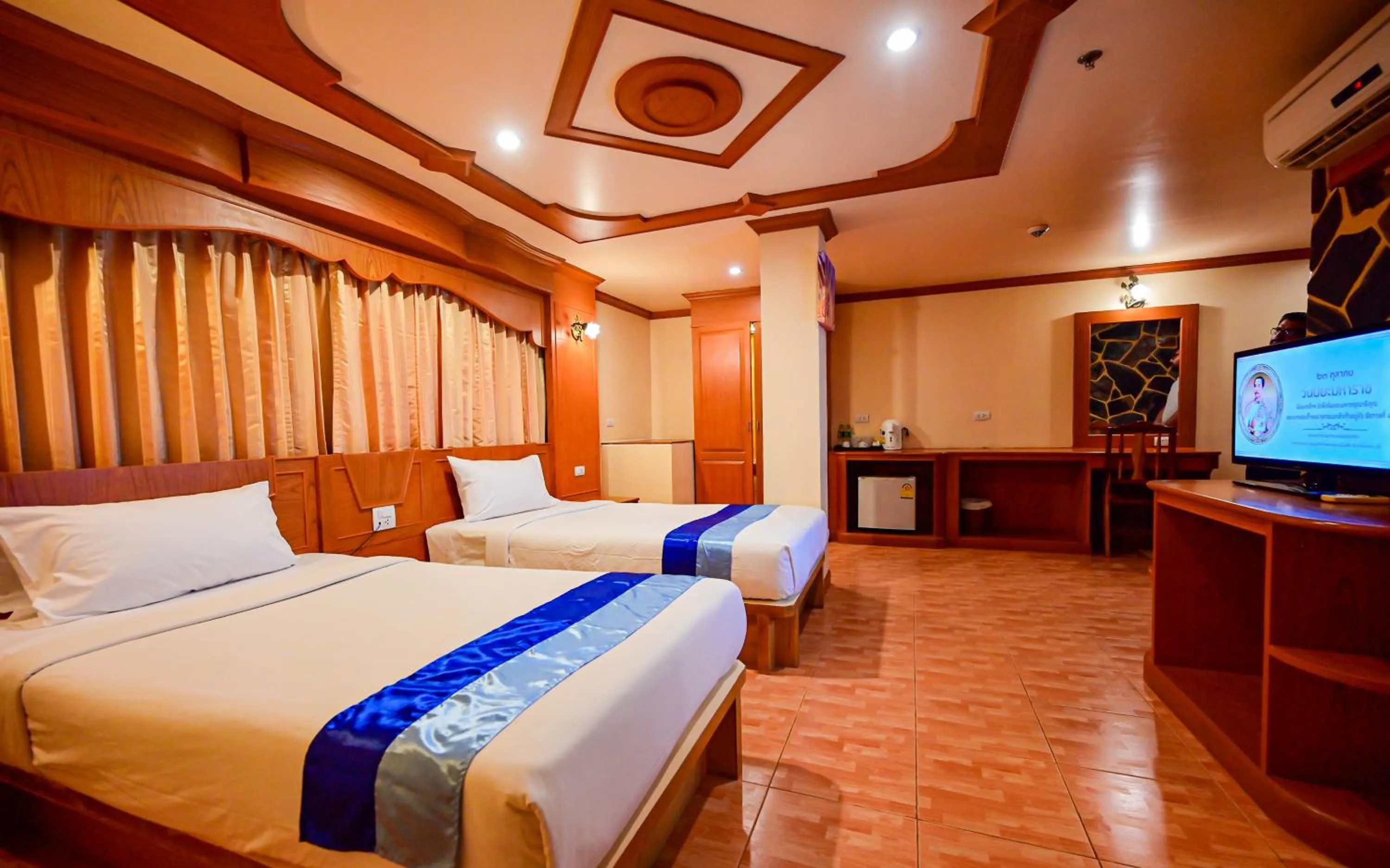 Bed in Tiger Complex Hotel