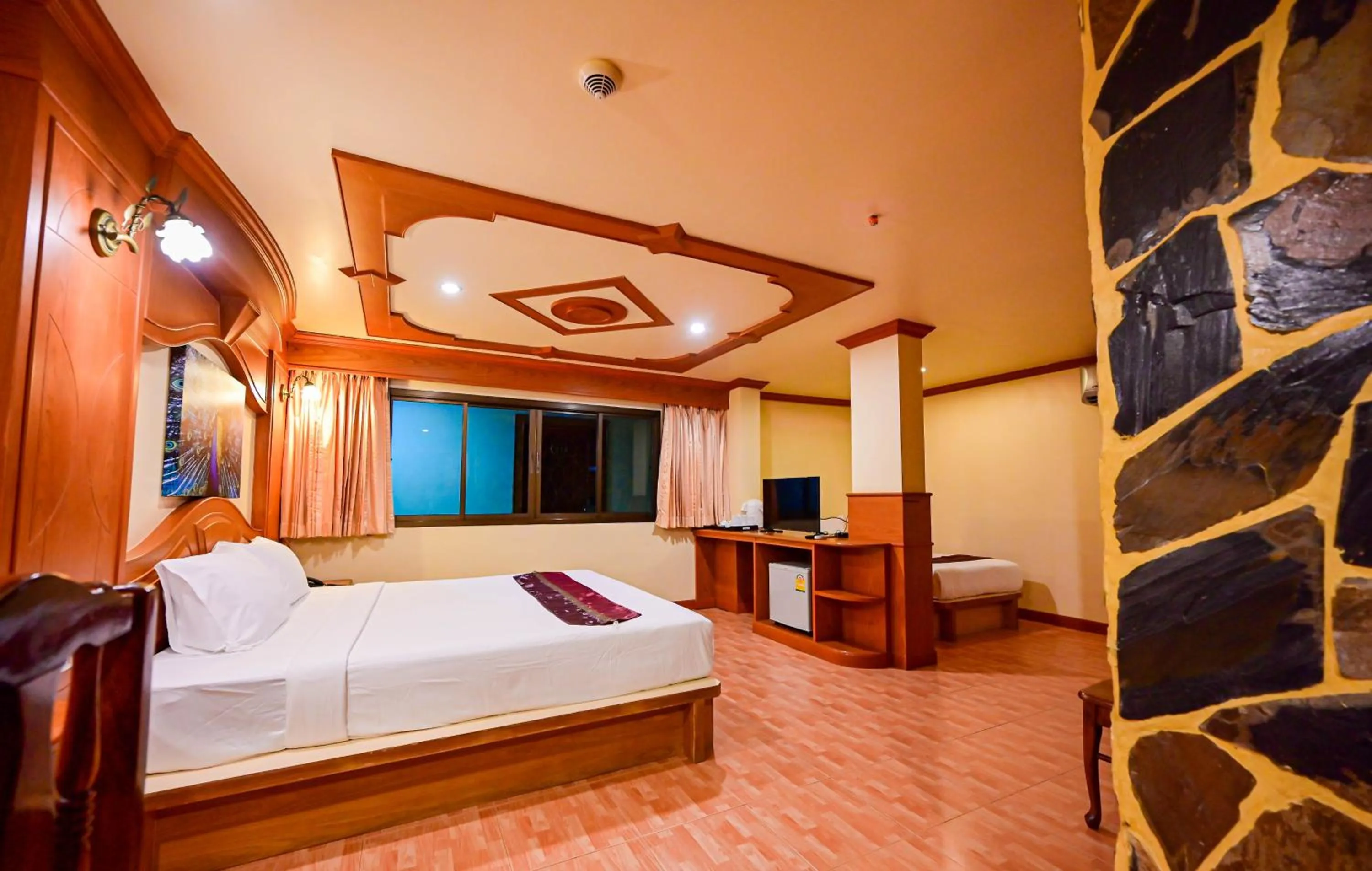 Bed in Tiger Complex Hotel