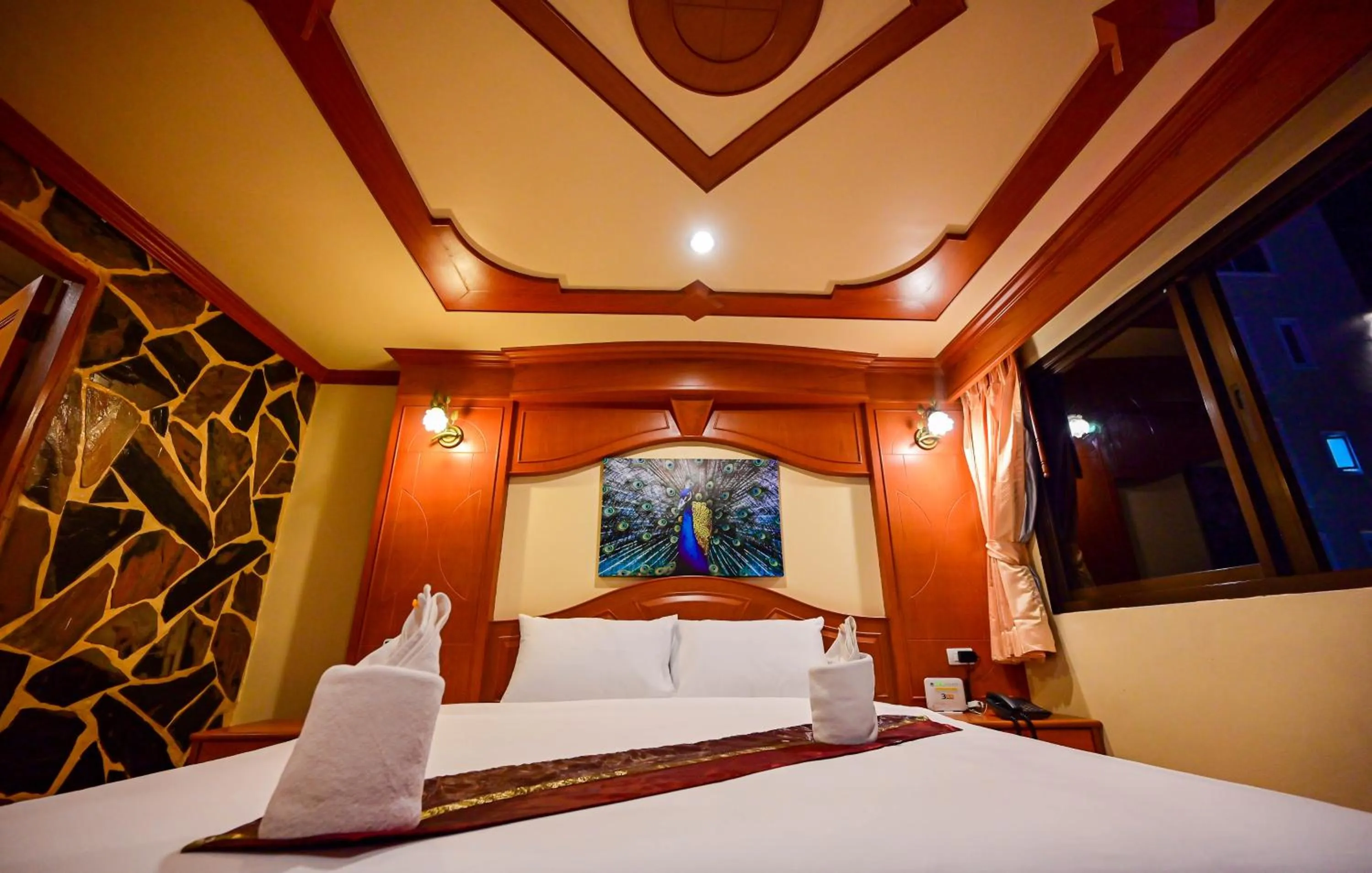 Bed in Tiger Complex Hotel