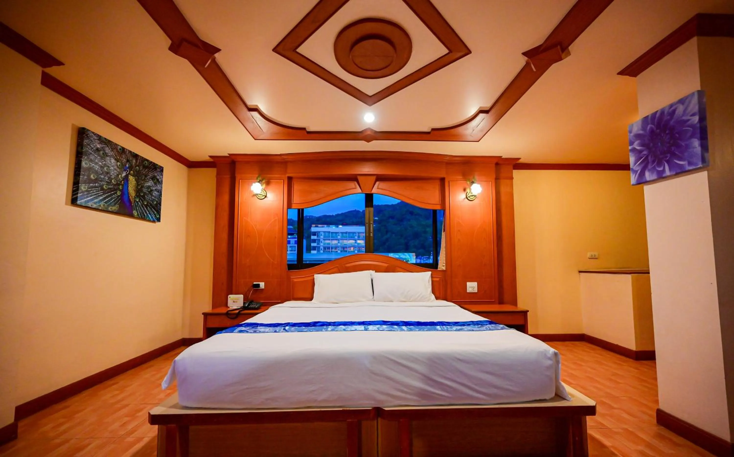 Bed in Tiger Complex Hotel