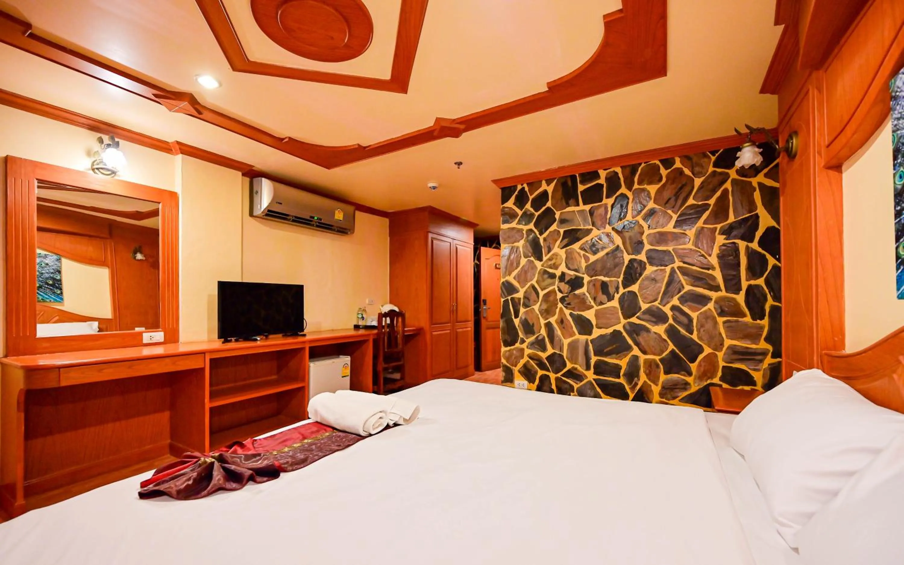 Bed in Tiger Complex Hotel