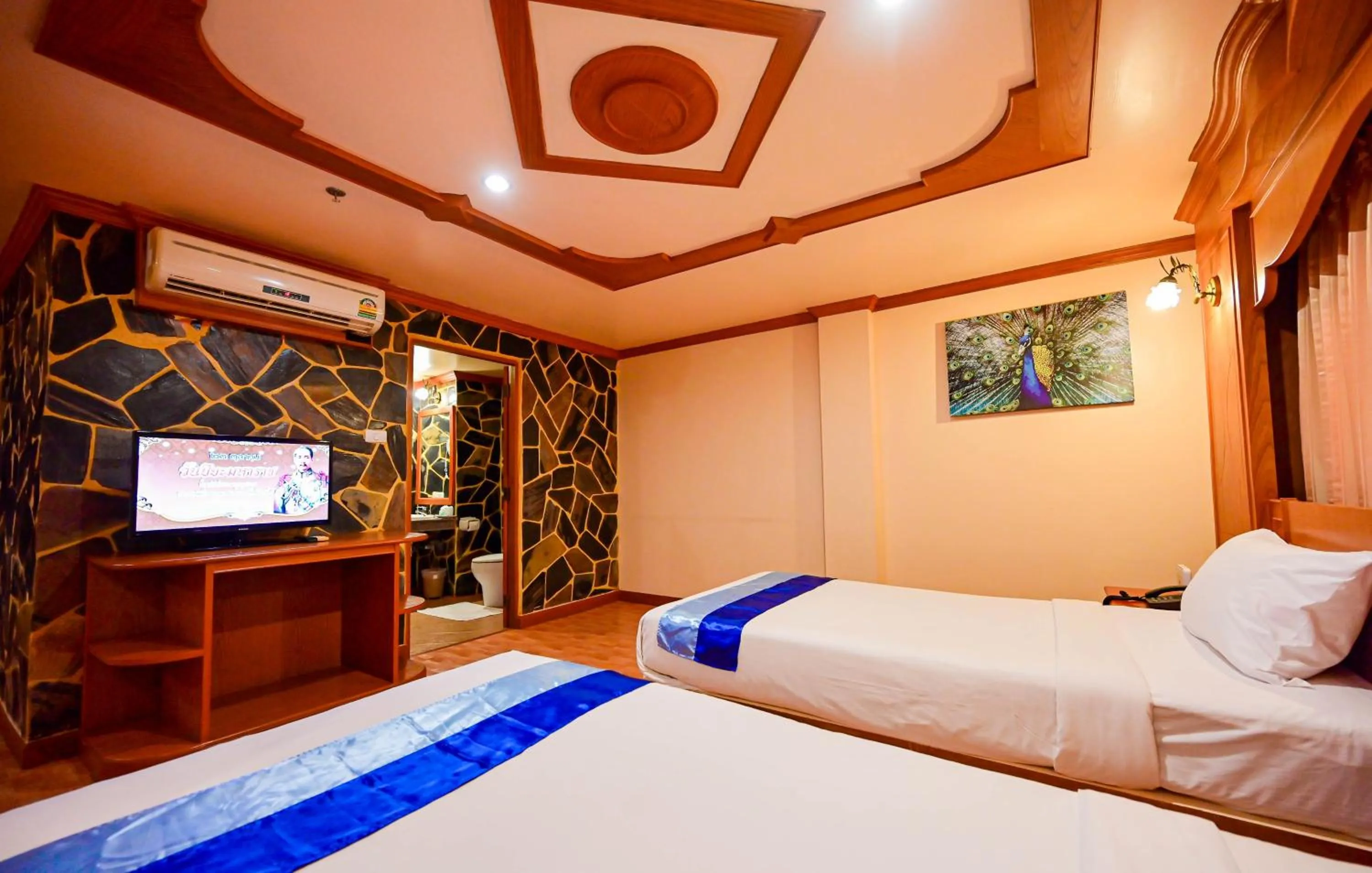 Bed in Tiger Complex Hotel