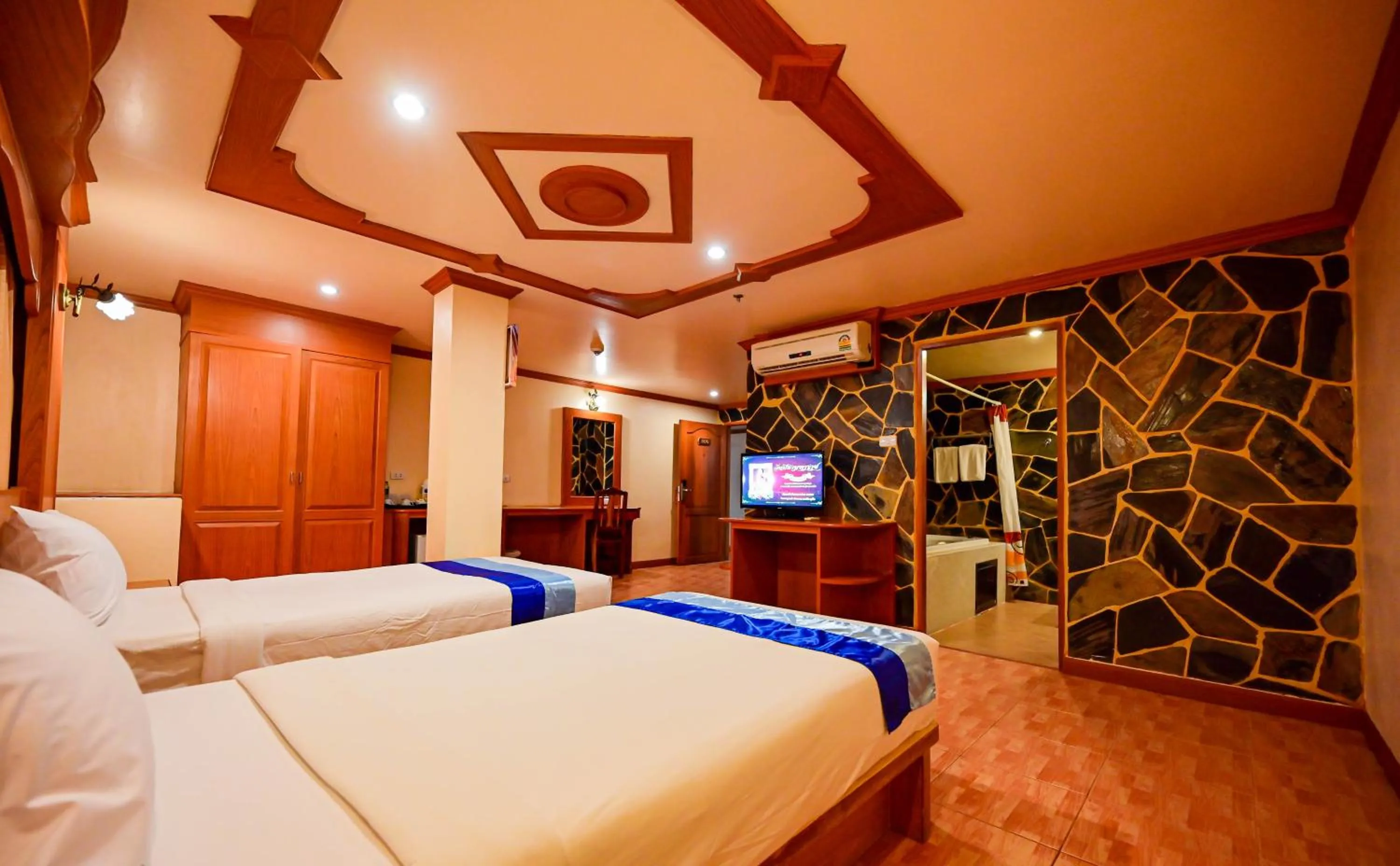 Bed in Tiger Complex Hotel