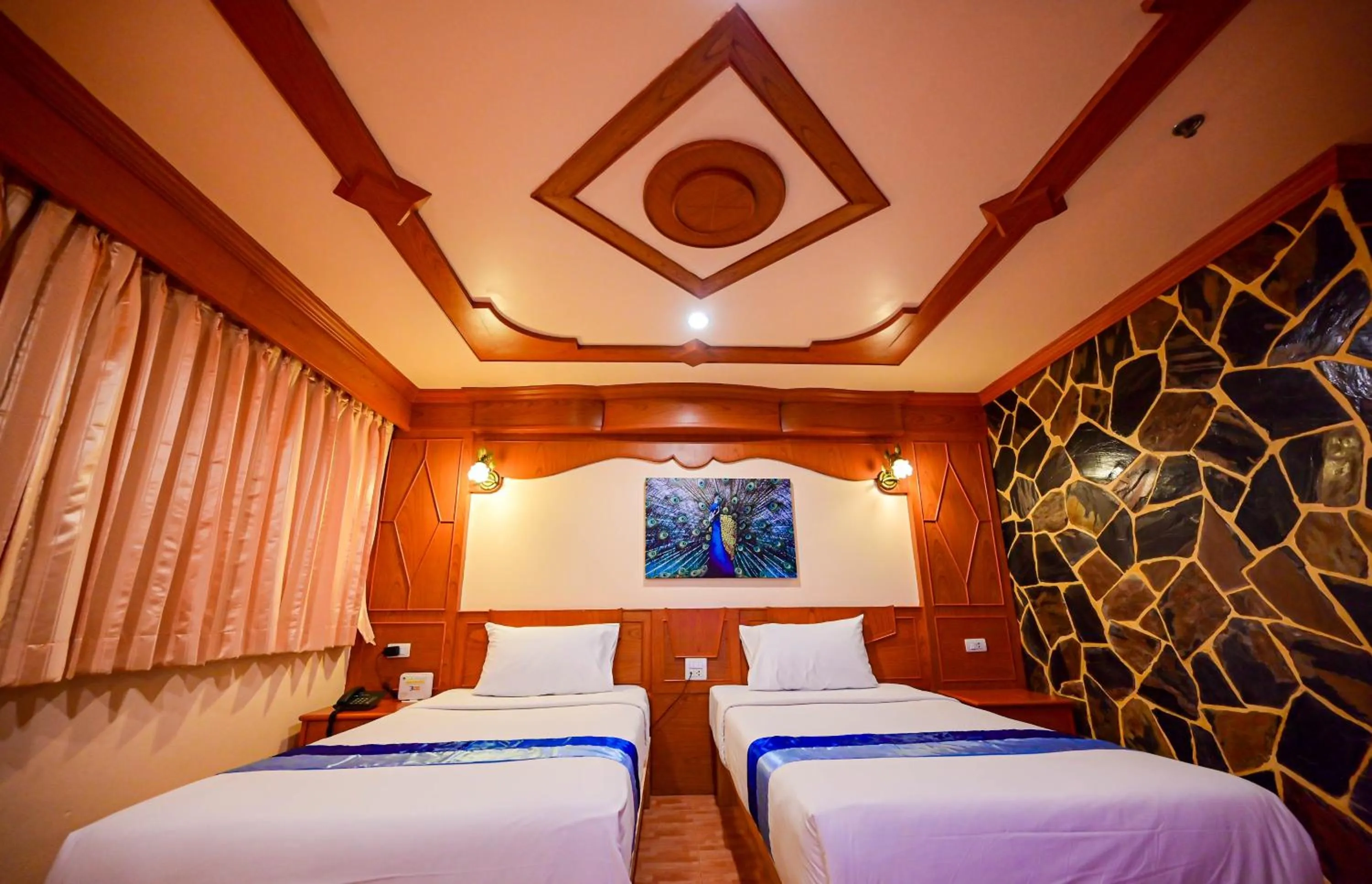 Bed in Tiger Complex Hotel