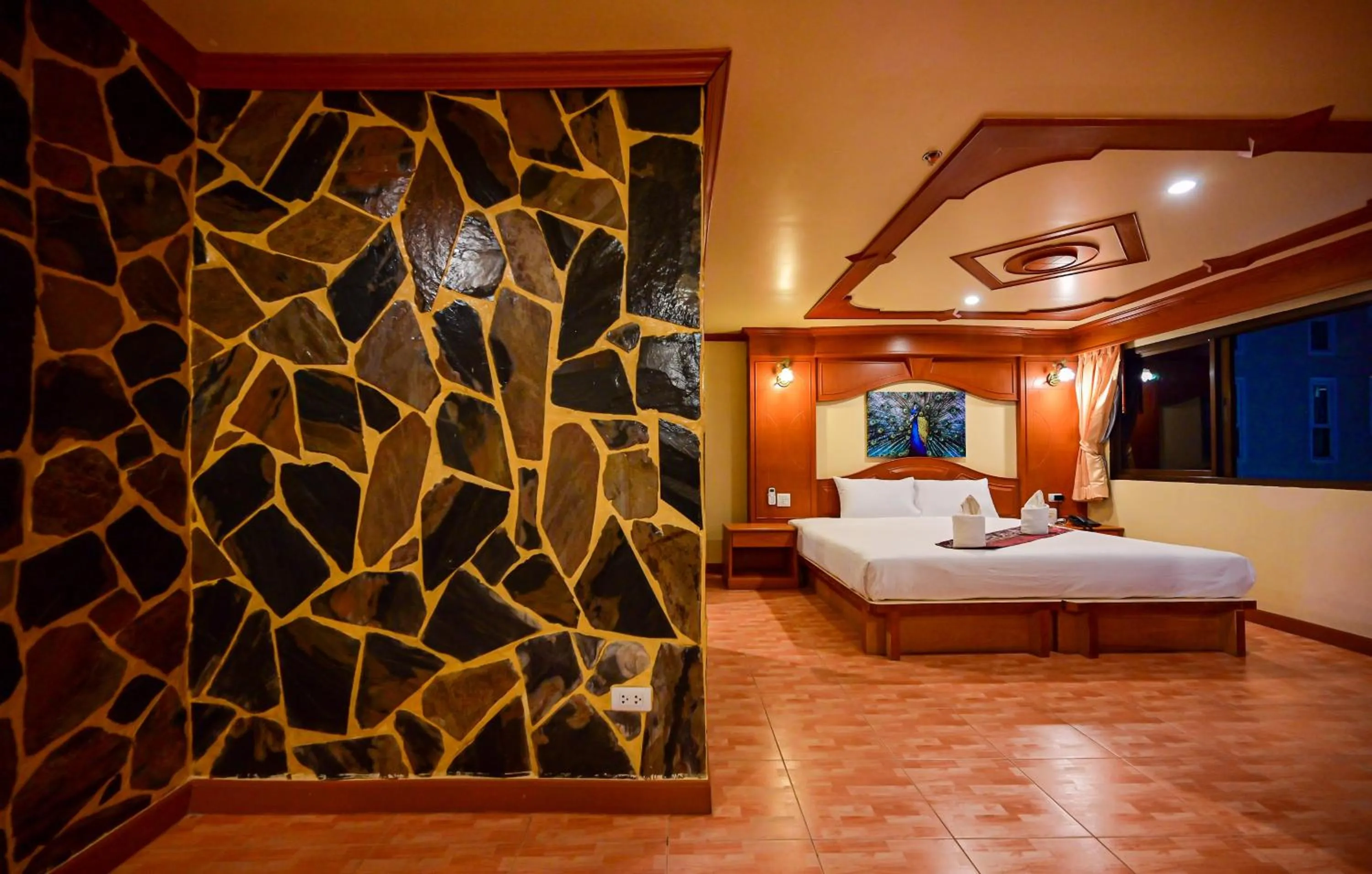 Bed in Tiger Complex Hotel