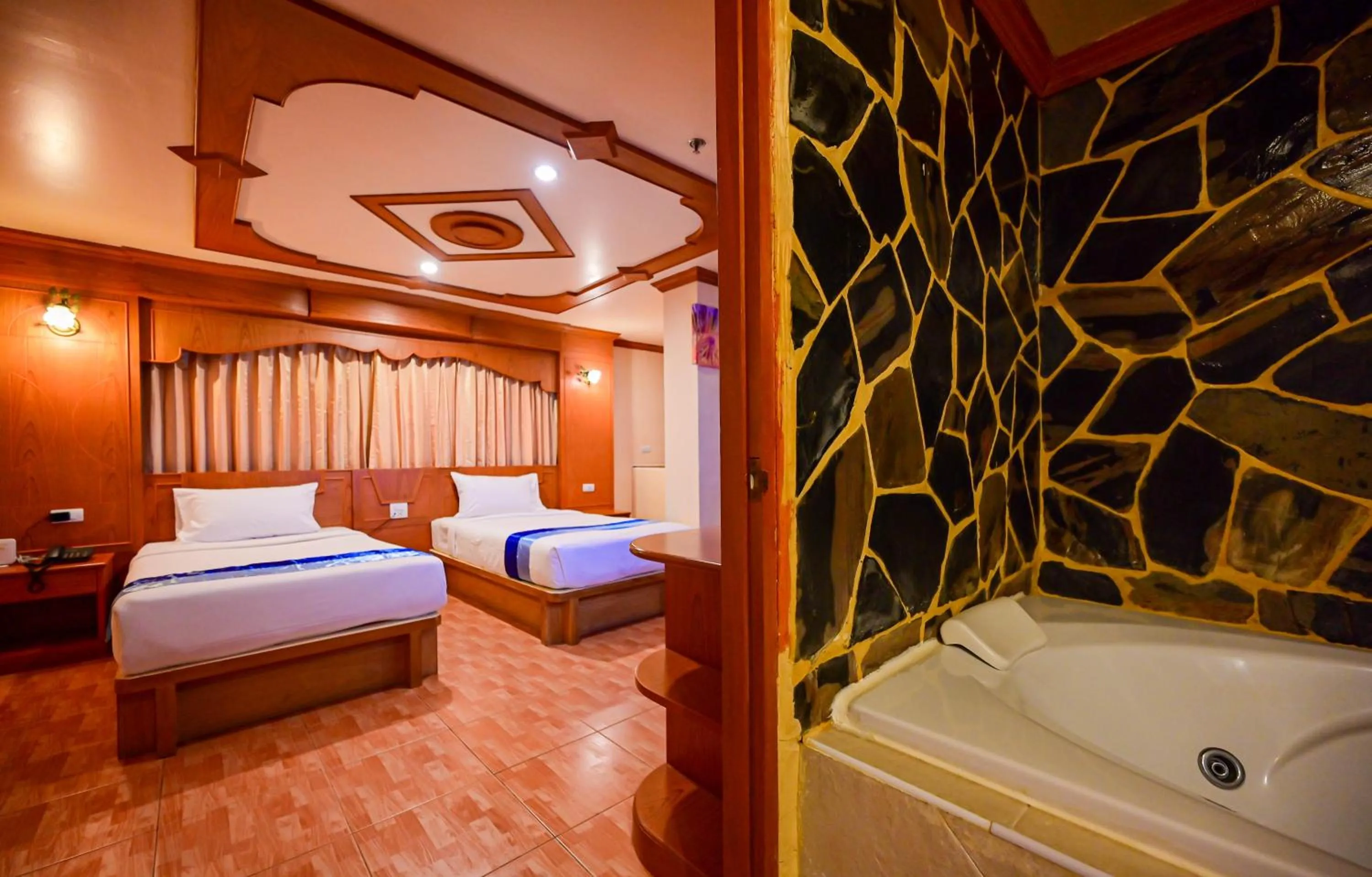 Bed in Tiger Complex Hotel