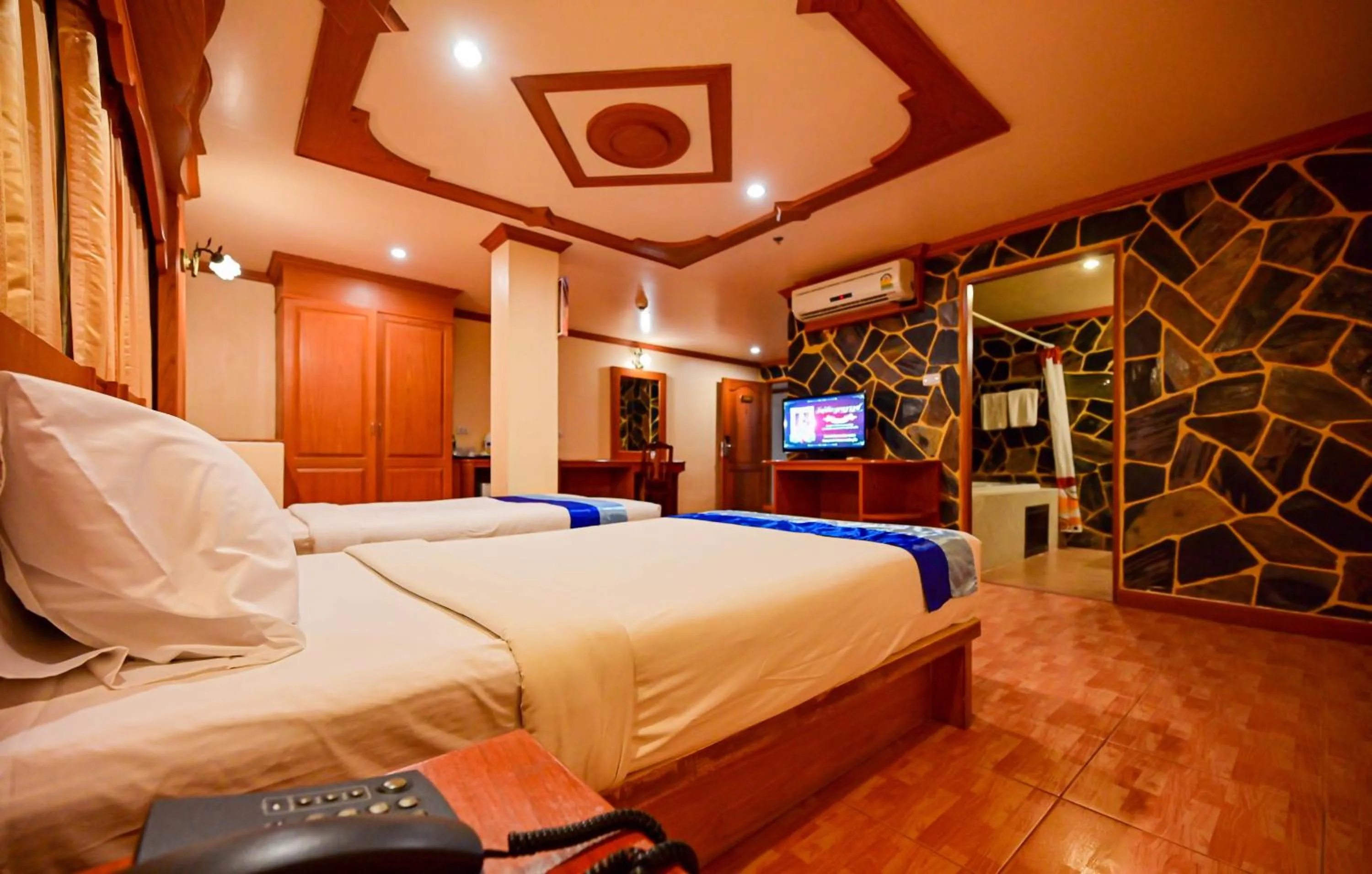 Bed in Tiger Complex Hotel