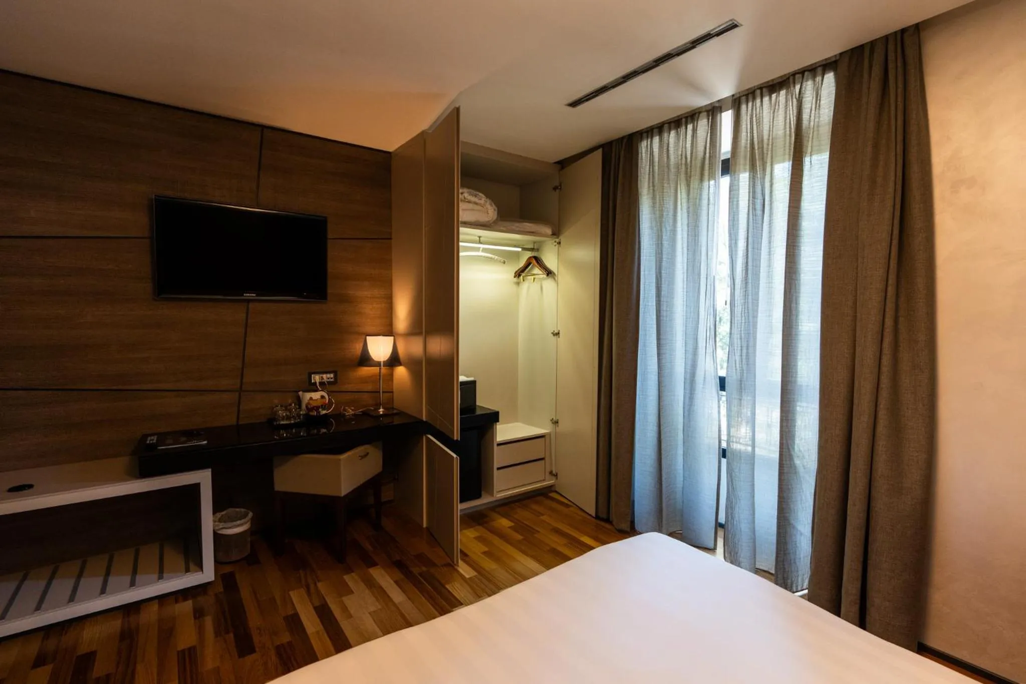 Bed in Divina Luxury Hotel