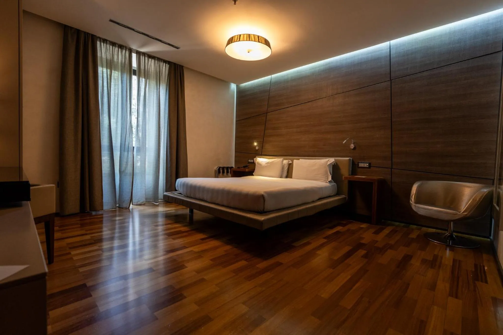 Bed in Divina Luxury Hotel