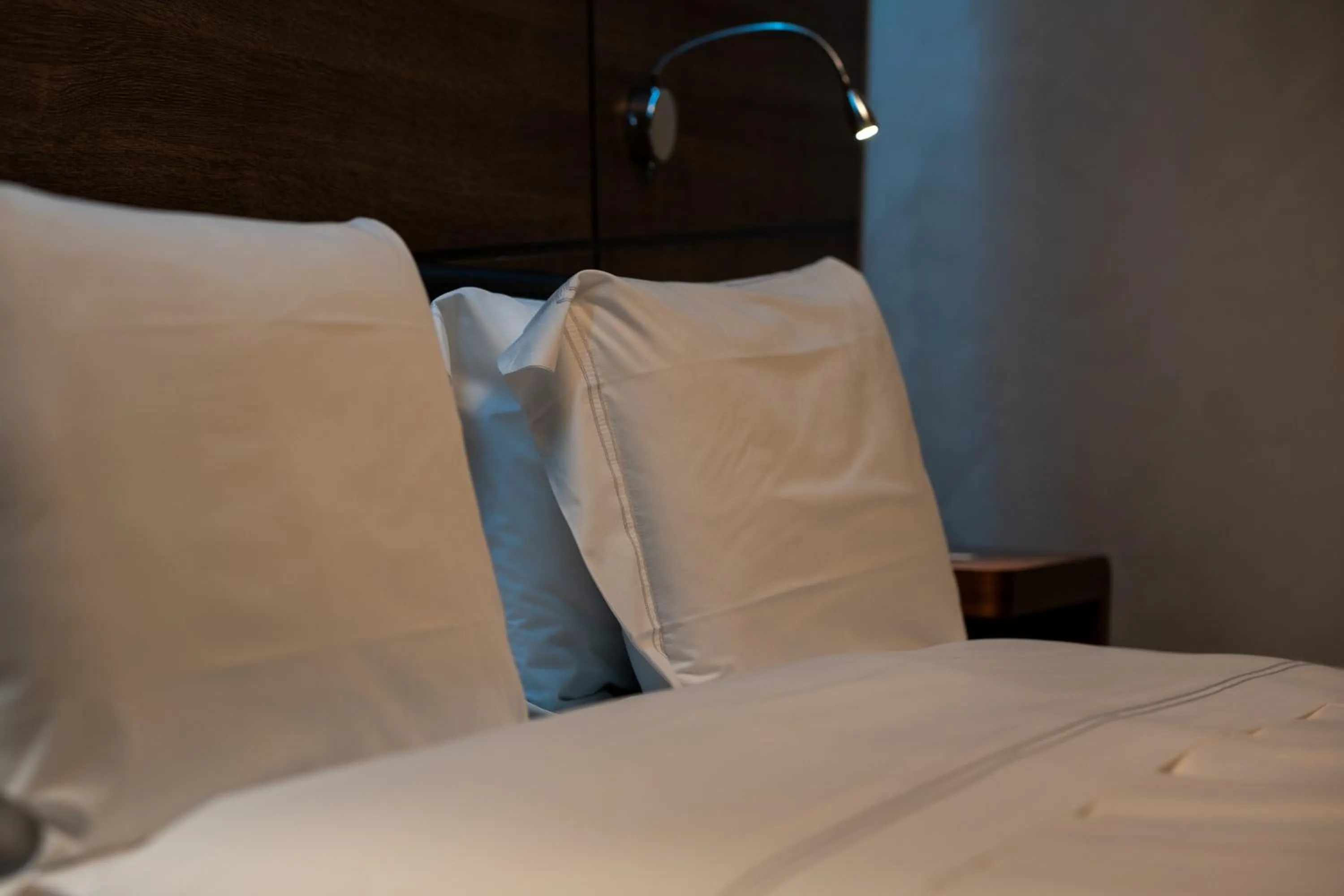 Bed in Divina Luxury Hotel