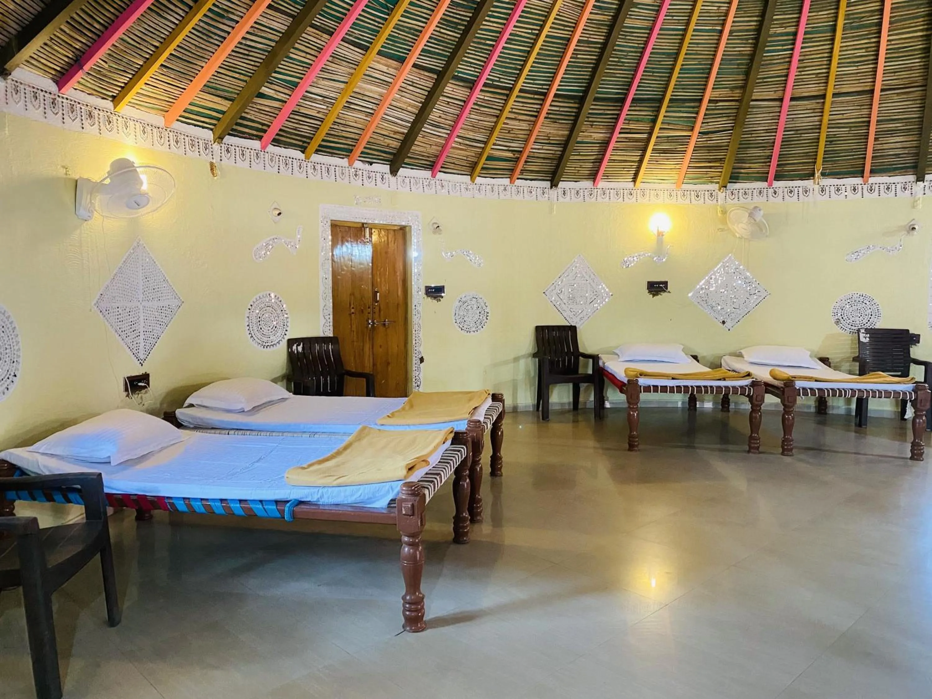 Bed in Santkrupa Villa Resort