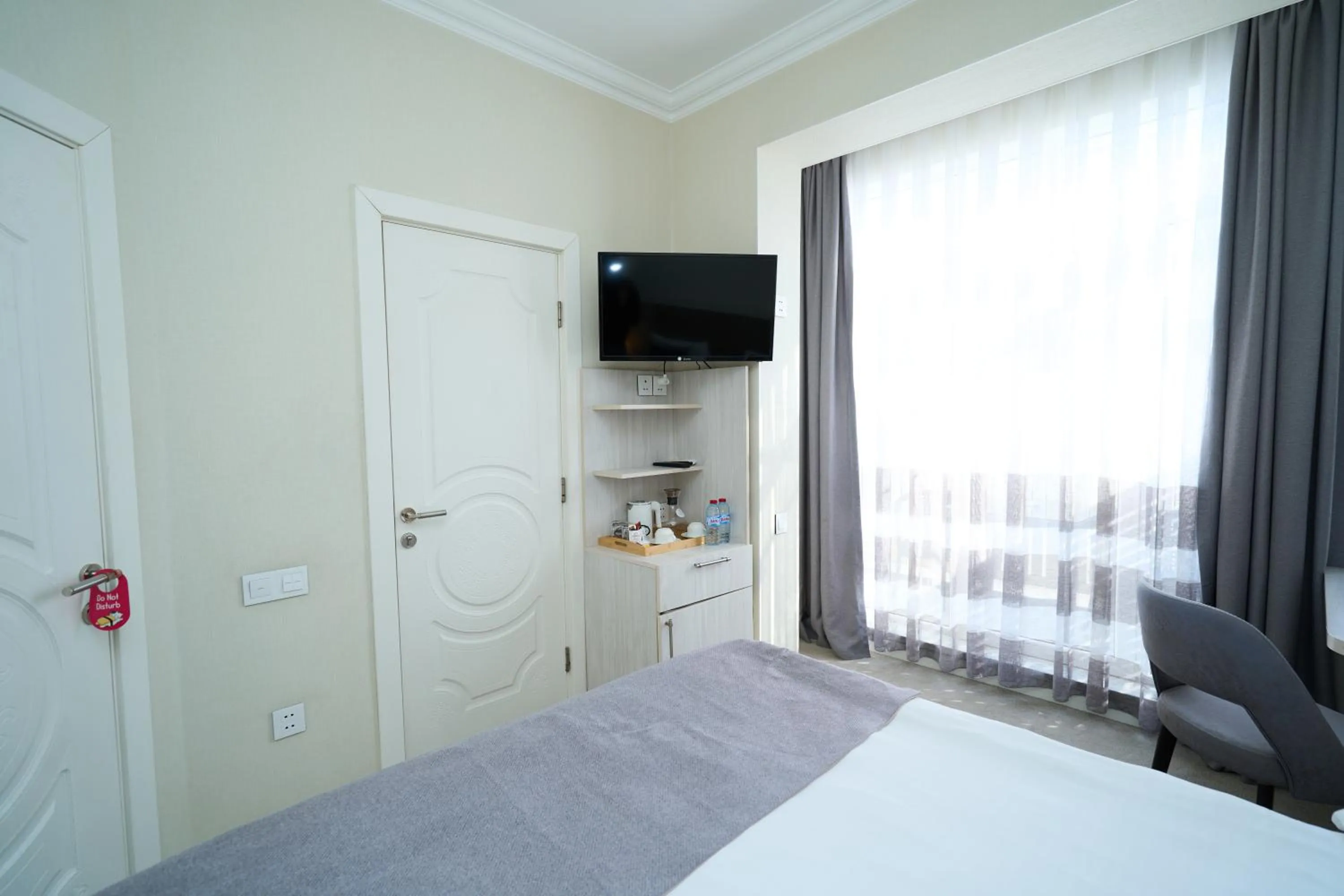 Bed in Zimmer Boutique Hotel