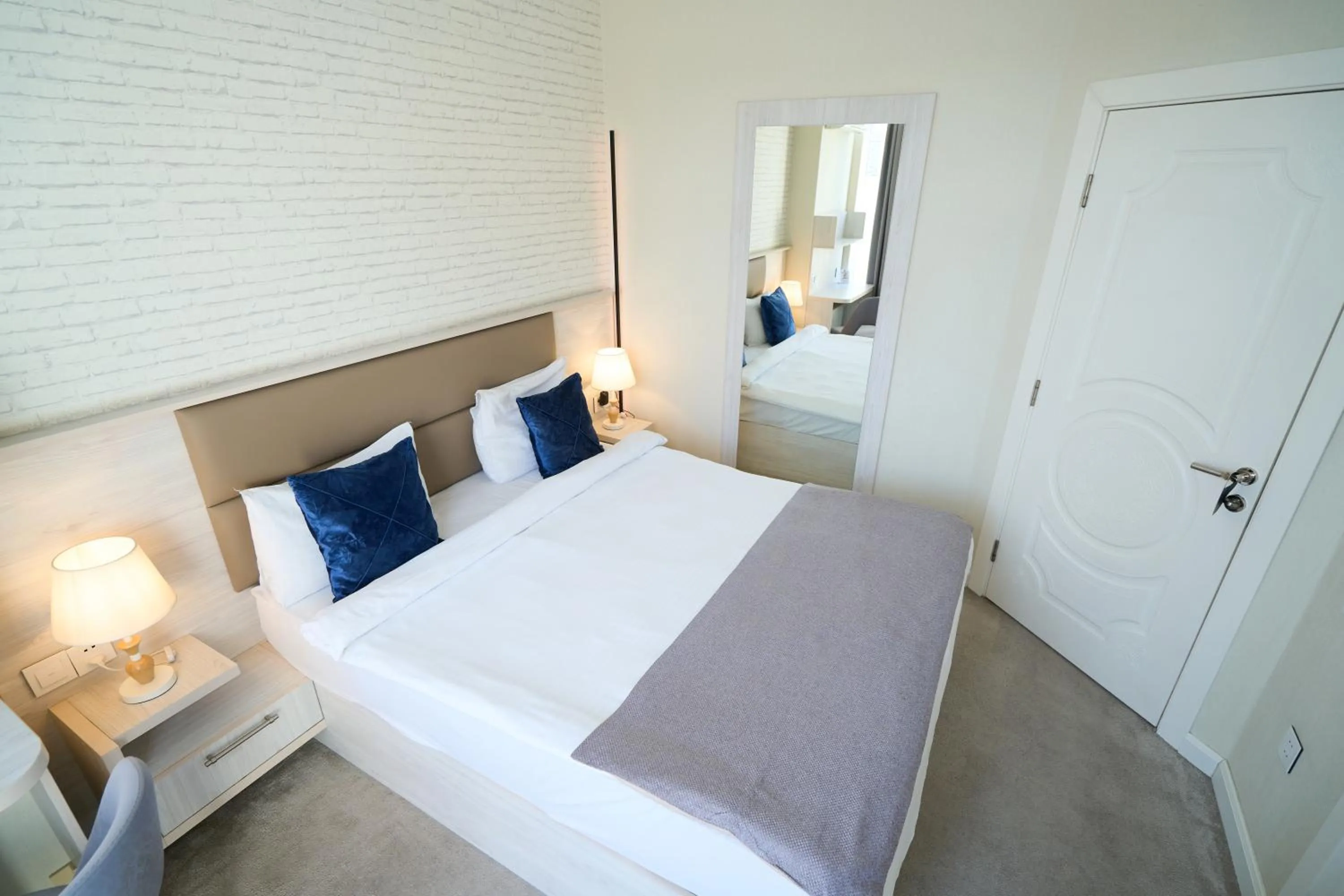 Bed in Zimmer Boutique Hotel