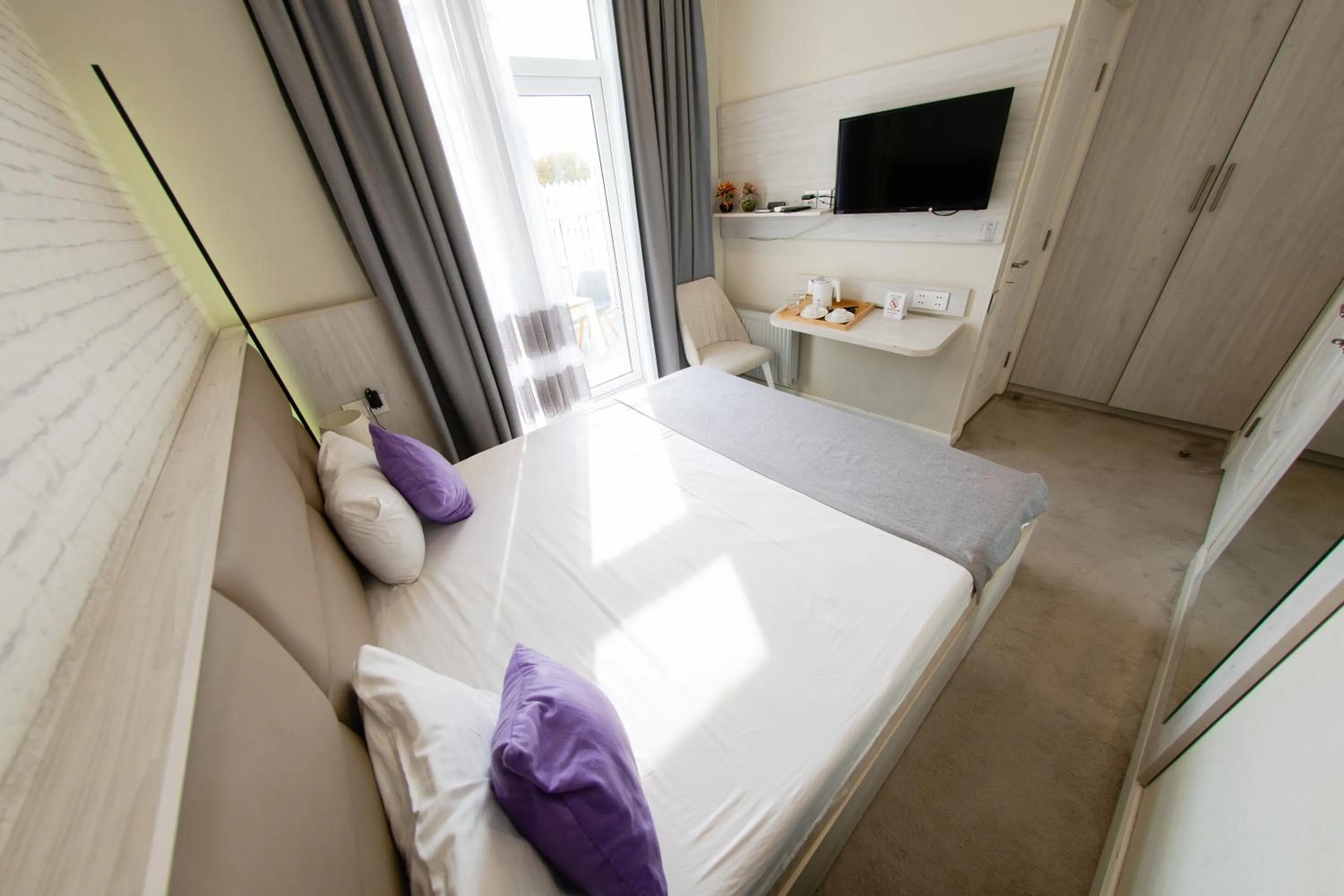 Bed in Zimmer Boutique Hotel