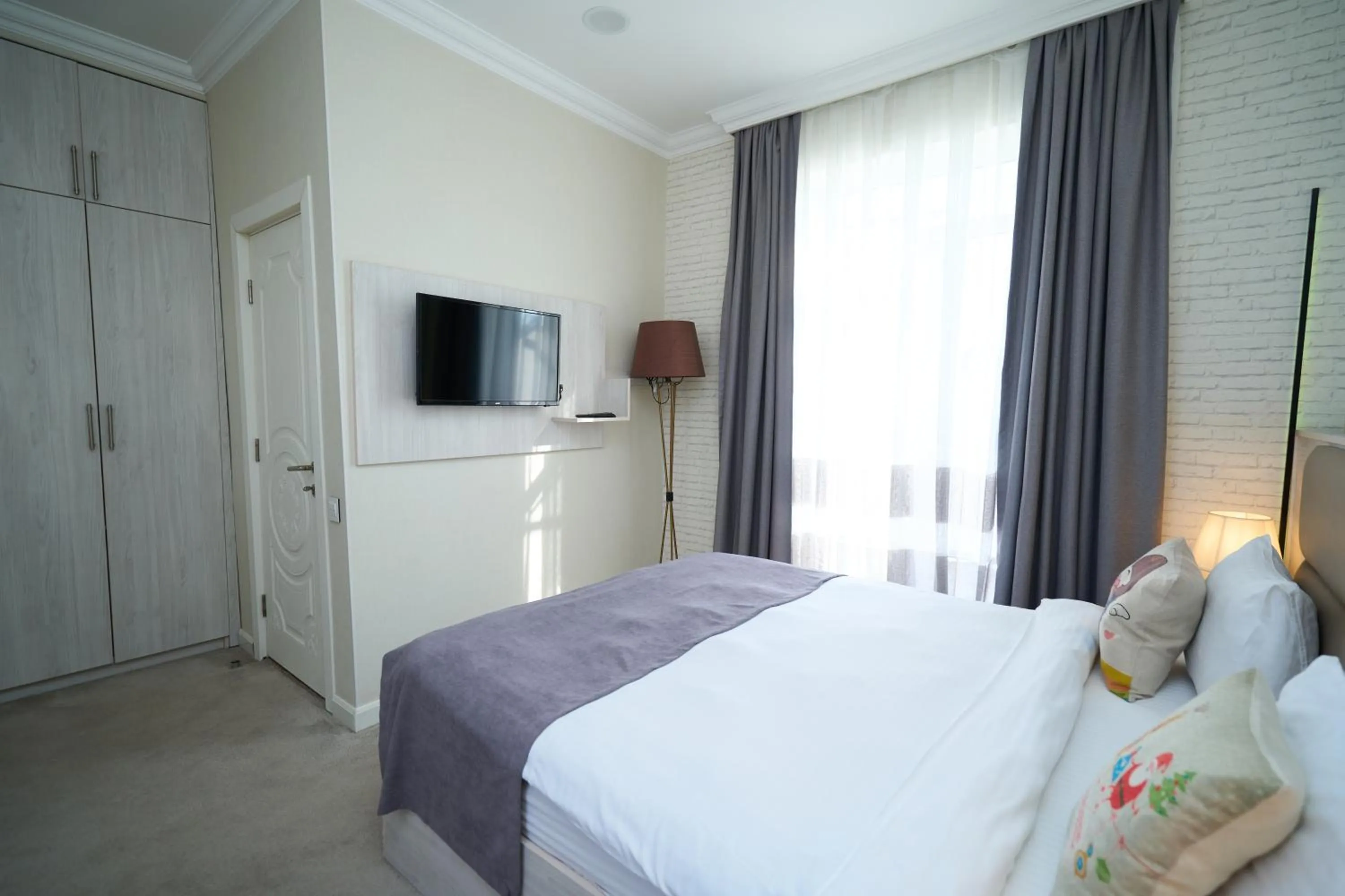 Bed in Zimmer Boutique Hotel