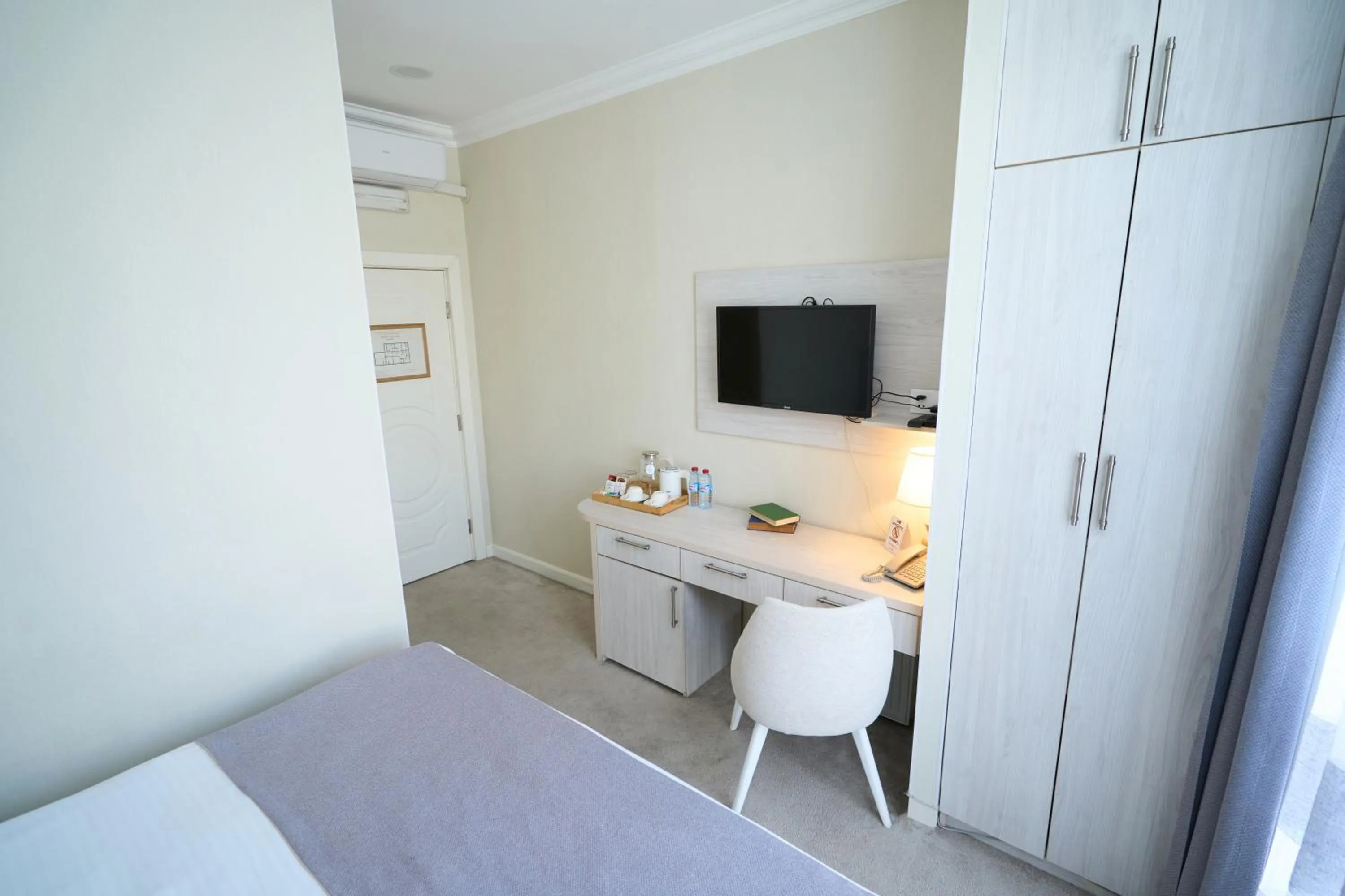 Bed in Zimmer Boutique Hotel