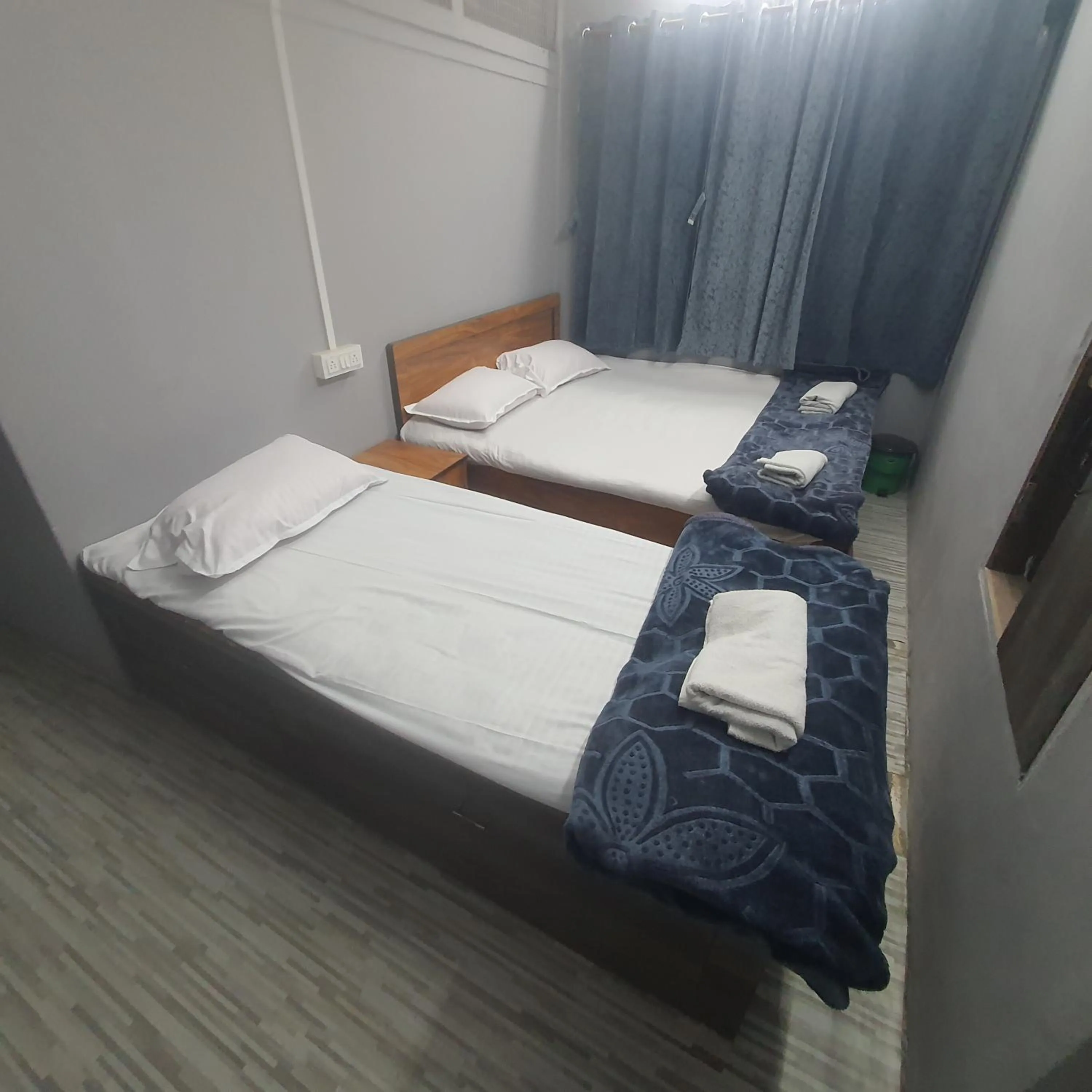 Bed in Hotel Family Stay Beside Railway Station