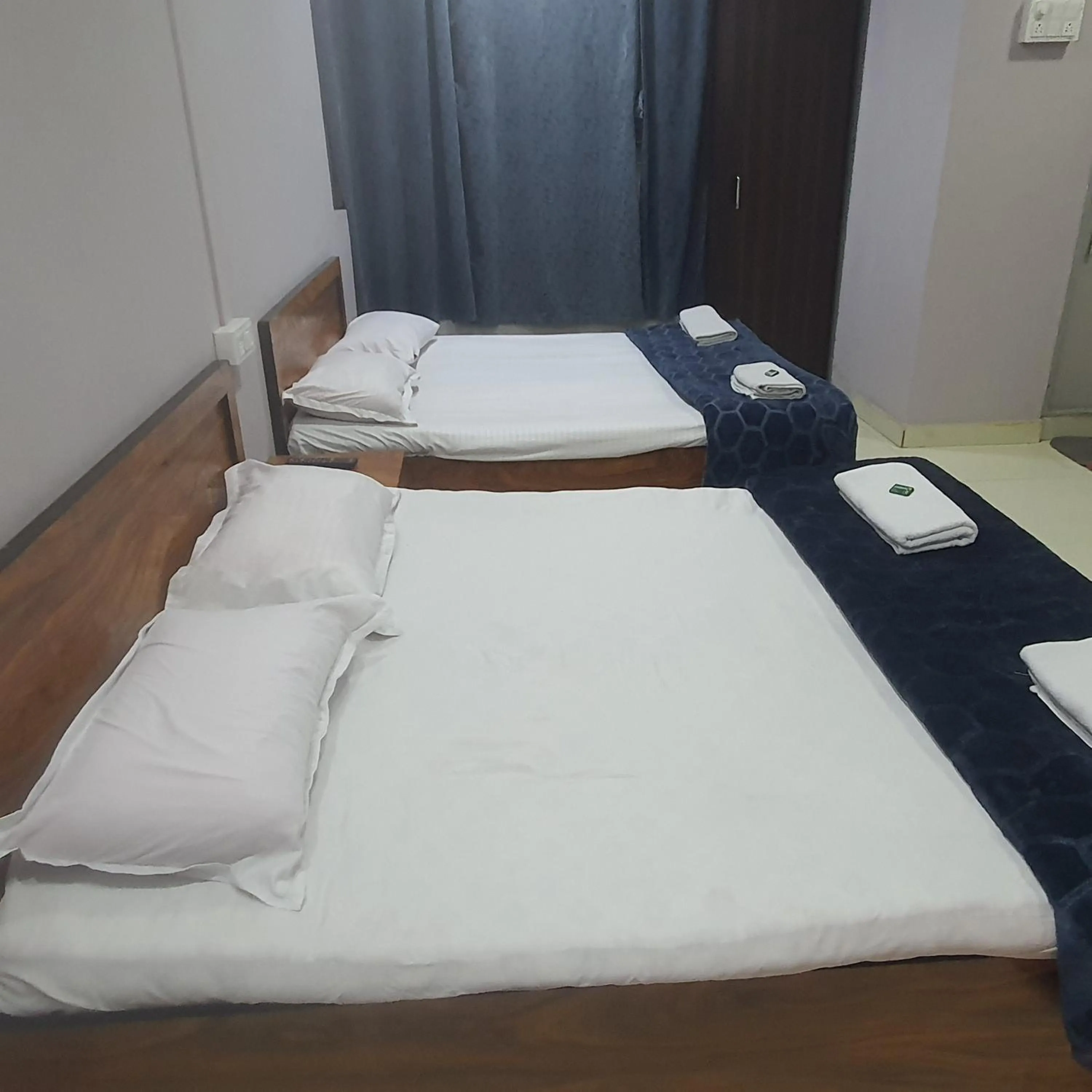Bed in Hotel Family Stay Beside Railway Station