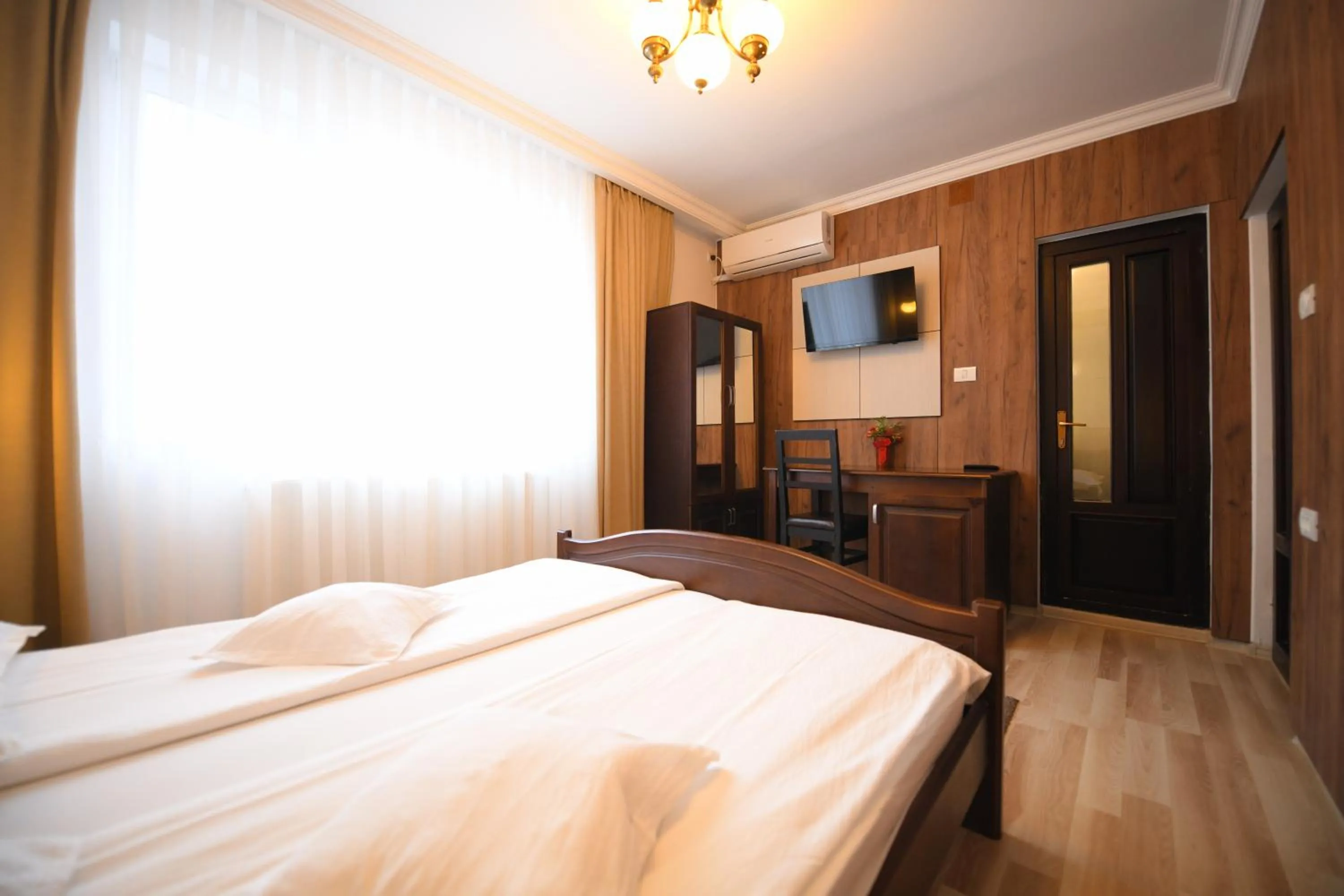 Photo of the whole room, Bed in Pensiunea Sarmis Cristal