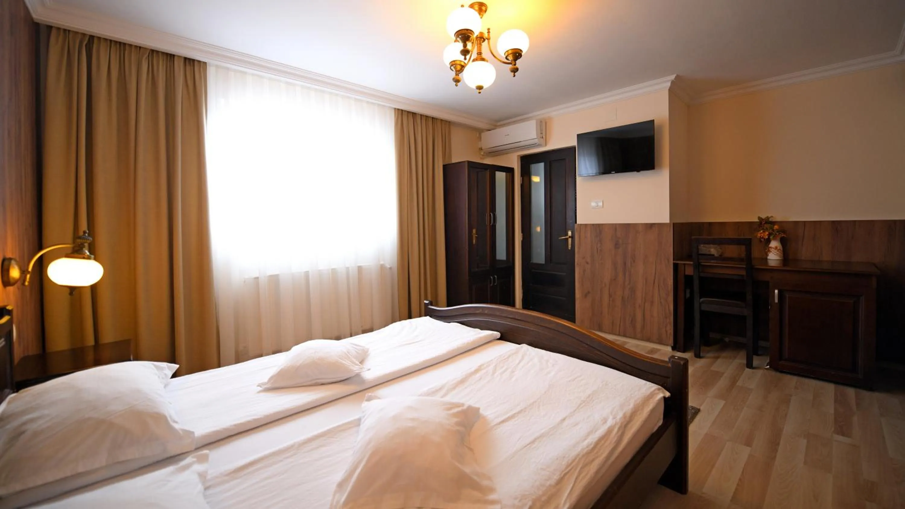 Photo of the whole room, Bed in Pensiunea Sarmis Cristal