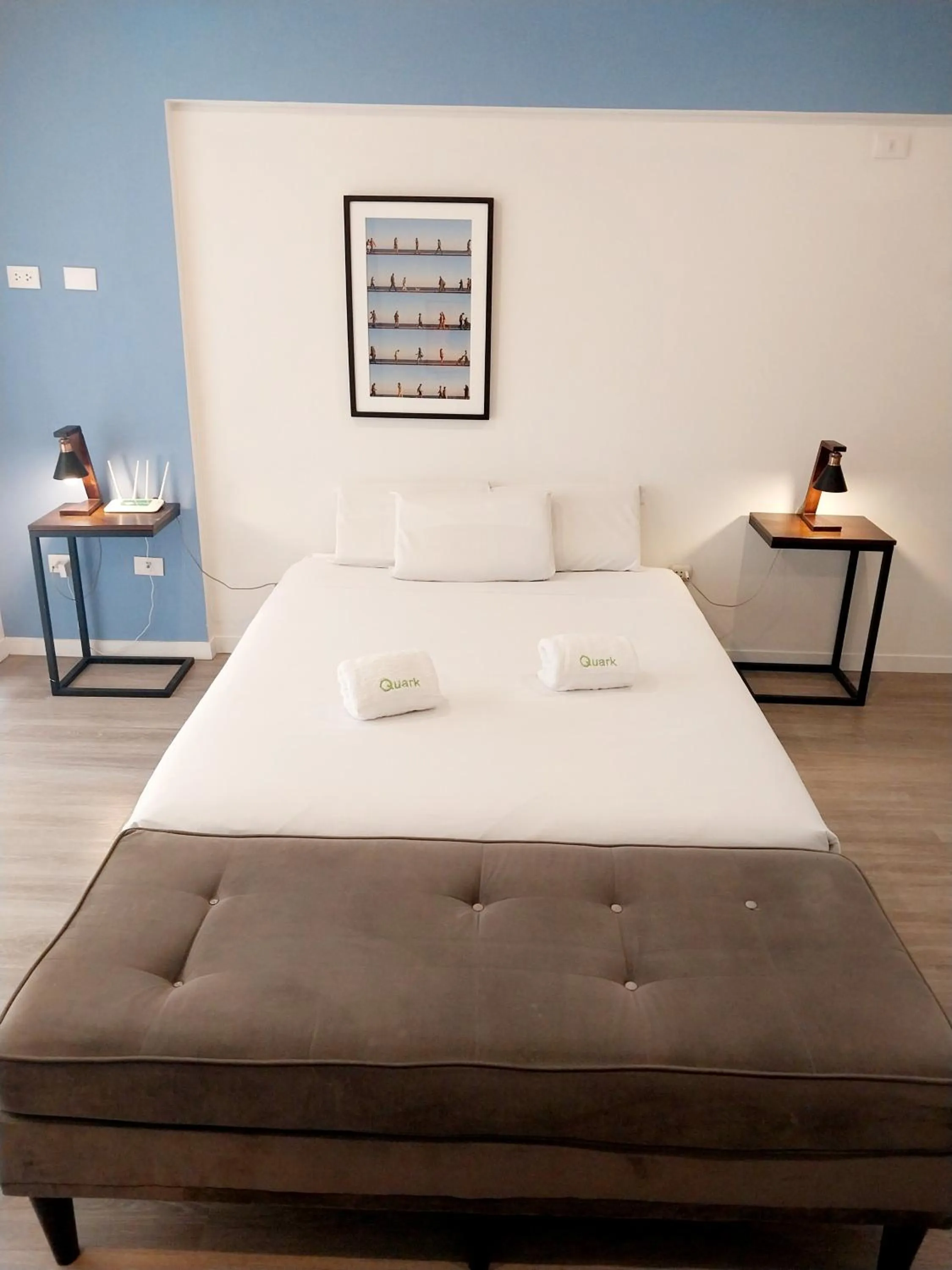 Bed in Quark Apartments