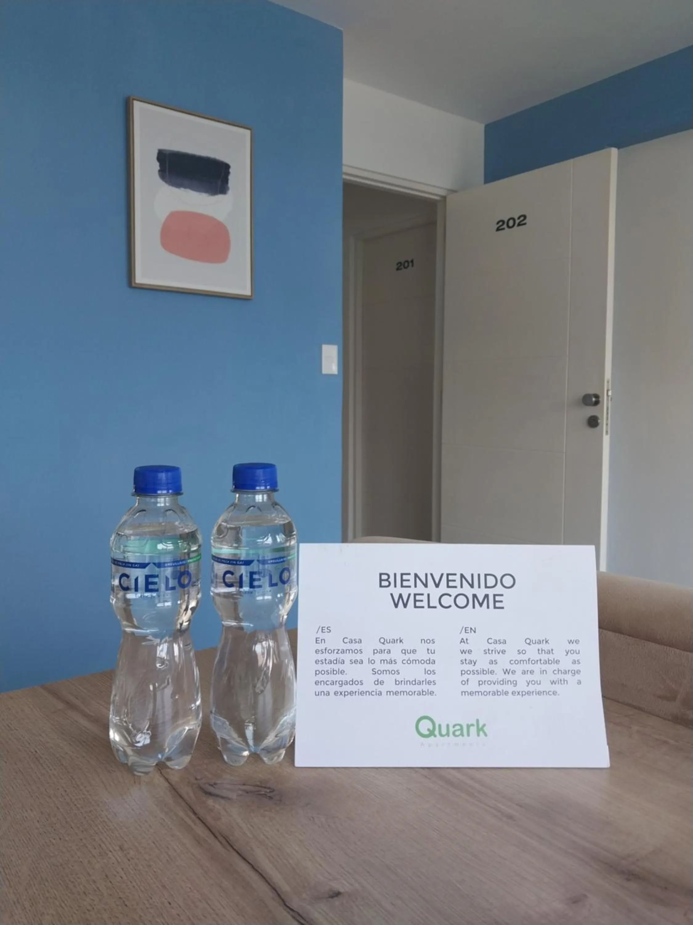 Property logo or sign in Quark Apartments