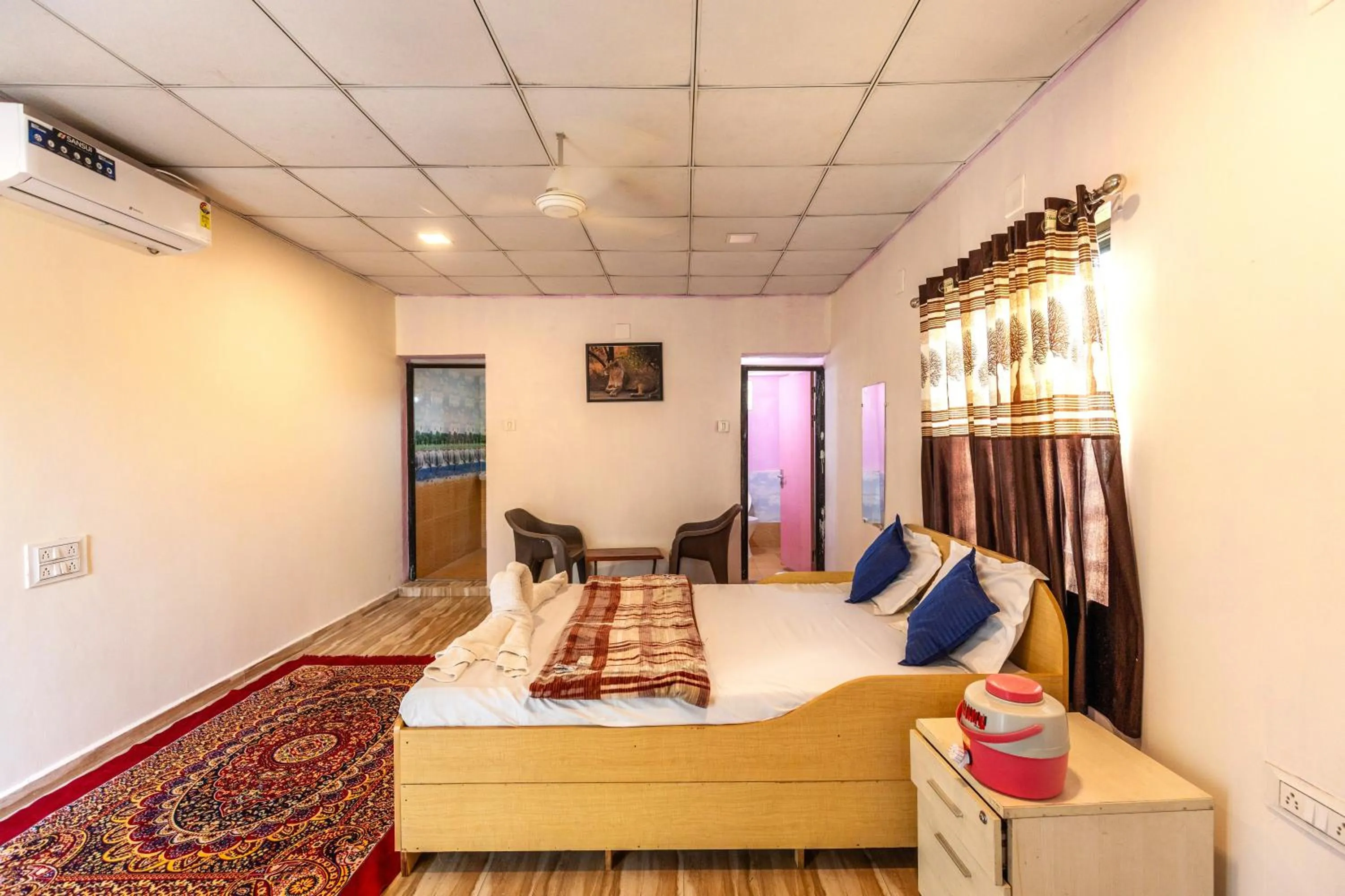 Photo of the whole room, Bed in AamraKunj Gir Resort