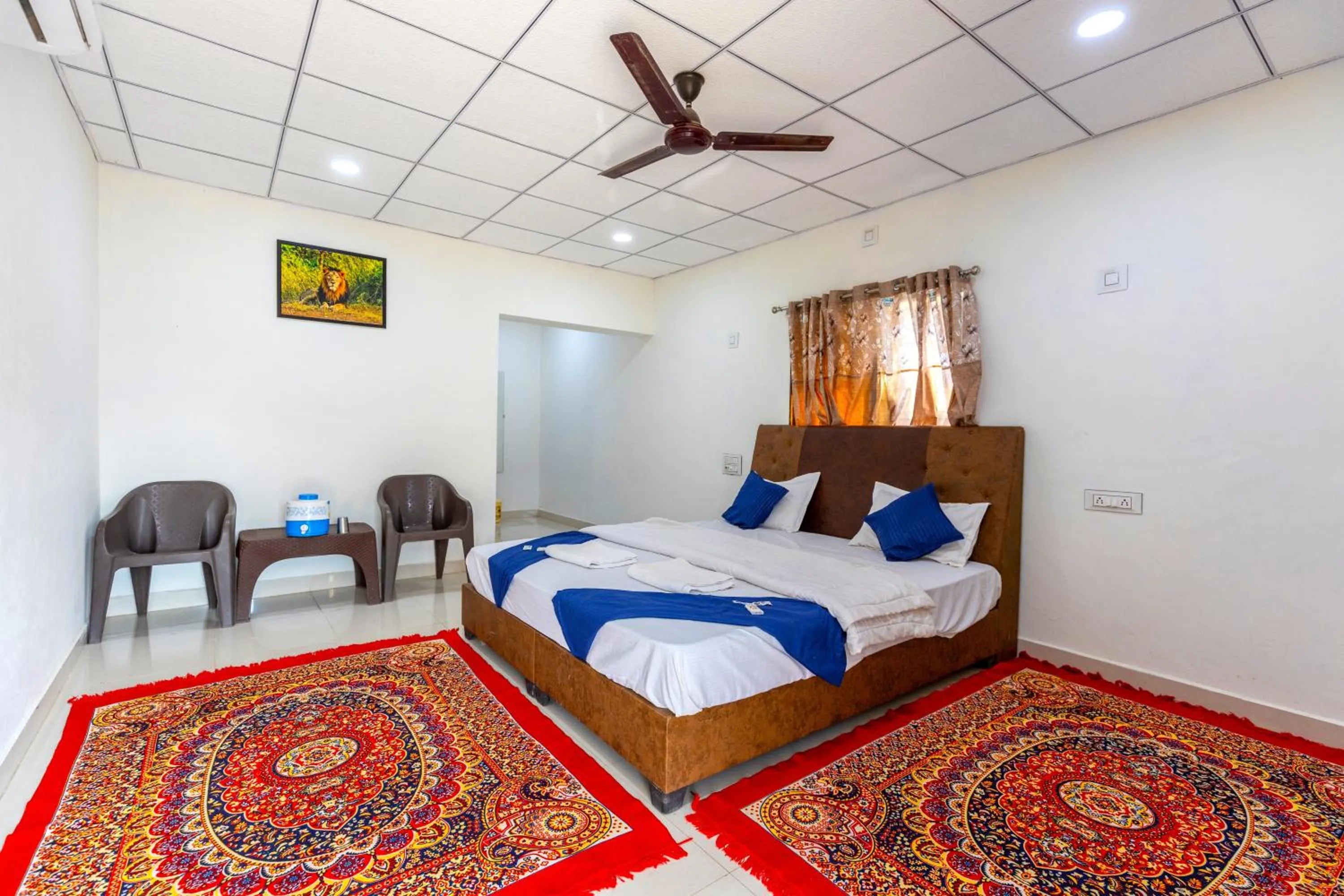 Bed in AamraKunj Gir Resort