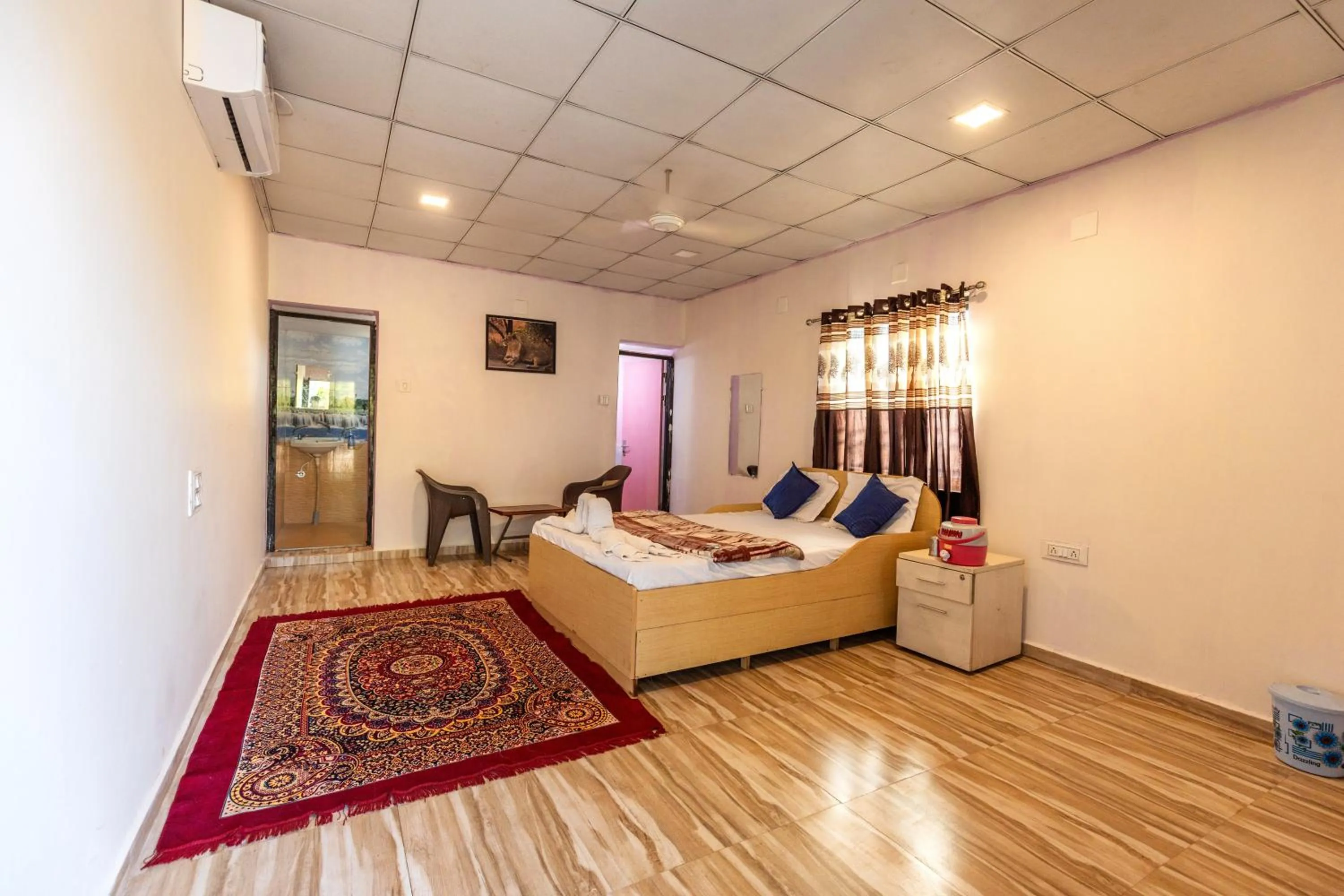 Photo of the whole room, Bed in AamraKunj Gir Resort